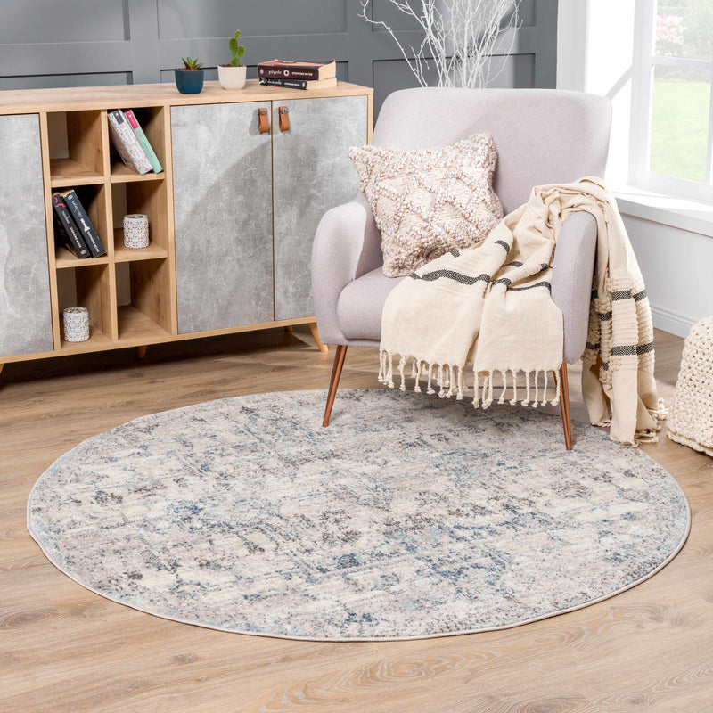Hauteloom Orrick area rug in a room scene, featuring a textured design in neutral tones on a hardwood floor.