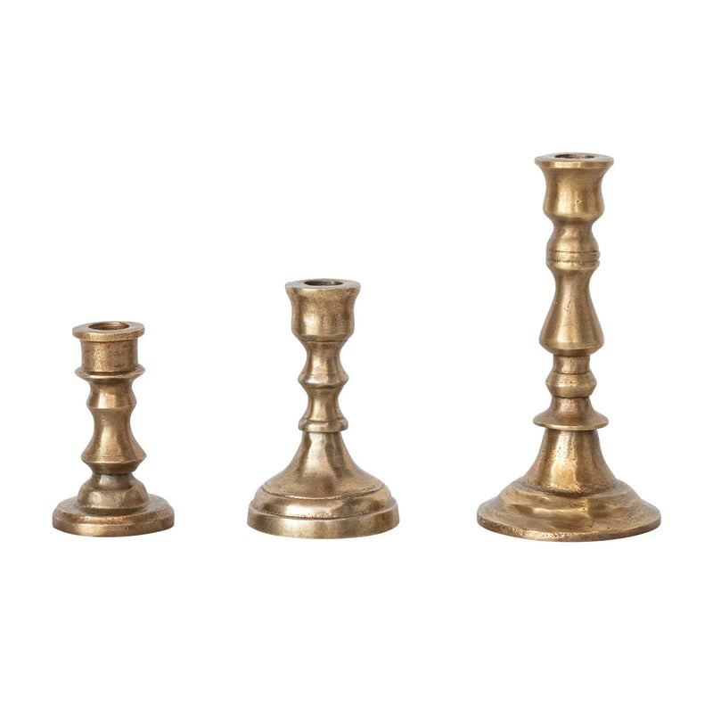 Antique brass finish cast aluminum taper candle holder in a classic design, fits 1/2-inch candles, available in three sizes.