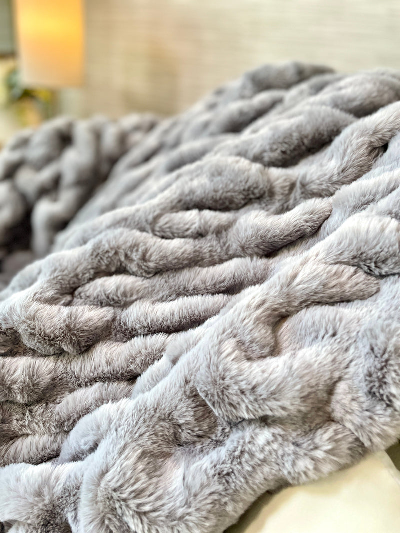 Medium gray faux fur blanket from Cloud9, 50x60 inches, soft and plush with a luxurious textured surface.