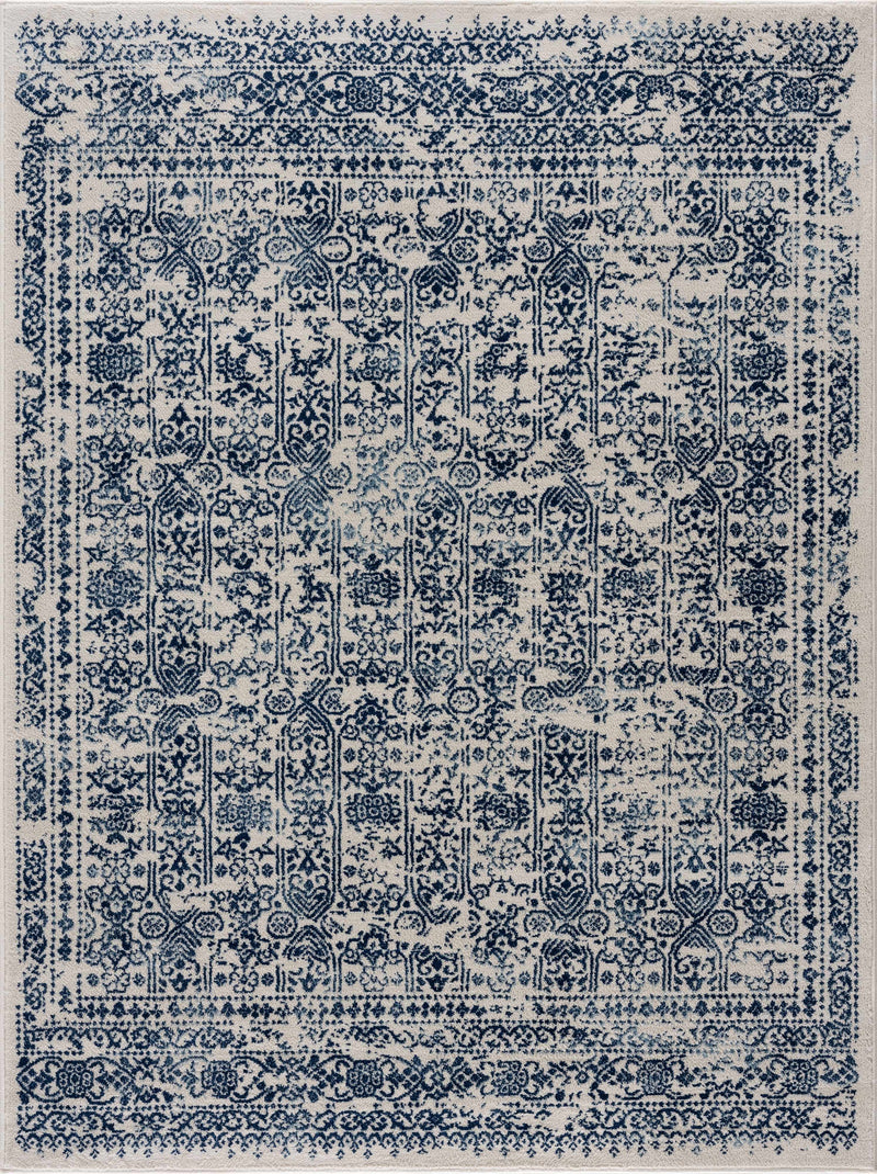 Hauteloom Michie Blue area rug with geometric pattern, soft fabric, and modern design for living room or bedroom decor.