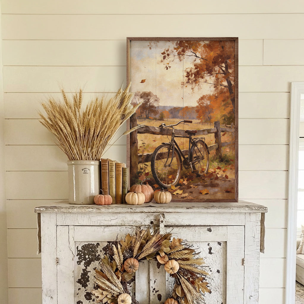 Walnut-framed autumn bicycle artwork featuring a country fence, designed by Kendrick Home. Bright fall colors and rustic scene.