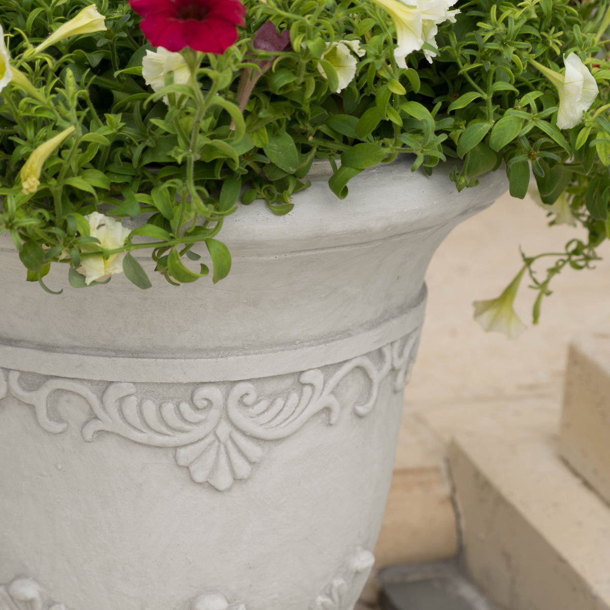 Antique white Moroccan urn planter made of durable magnesium oxide with intricate design, ideal for indoor or outdoor decor.
