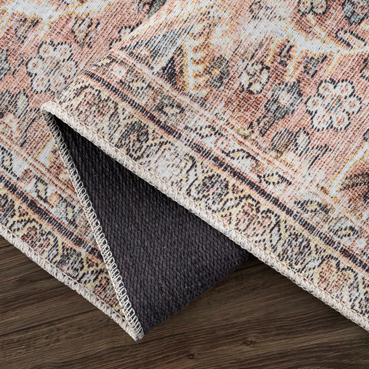 Hauteloom Urpi Rose and Brown washable area rug with floral pattern, soft texture, perfect for living room or bedroom decor.