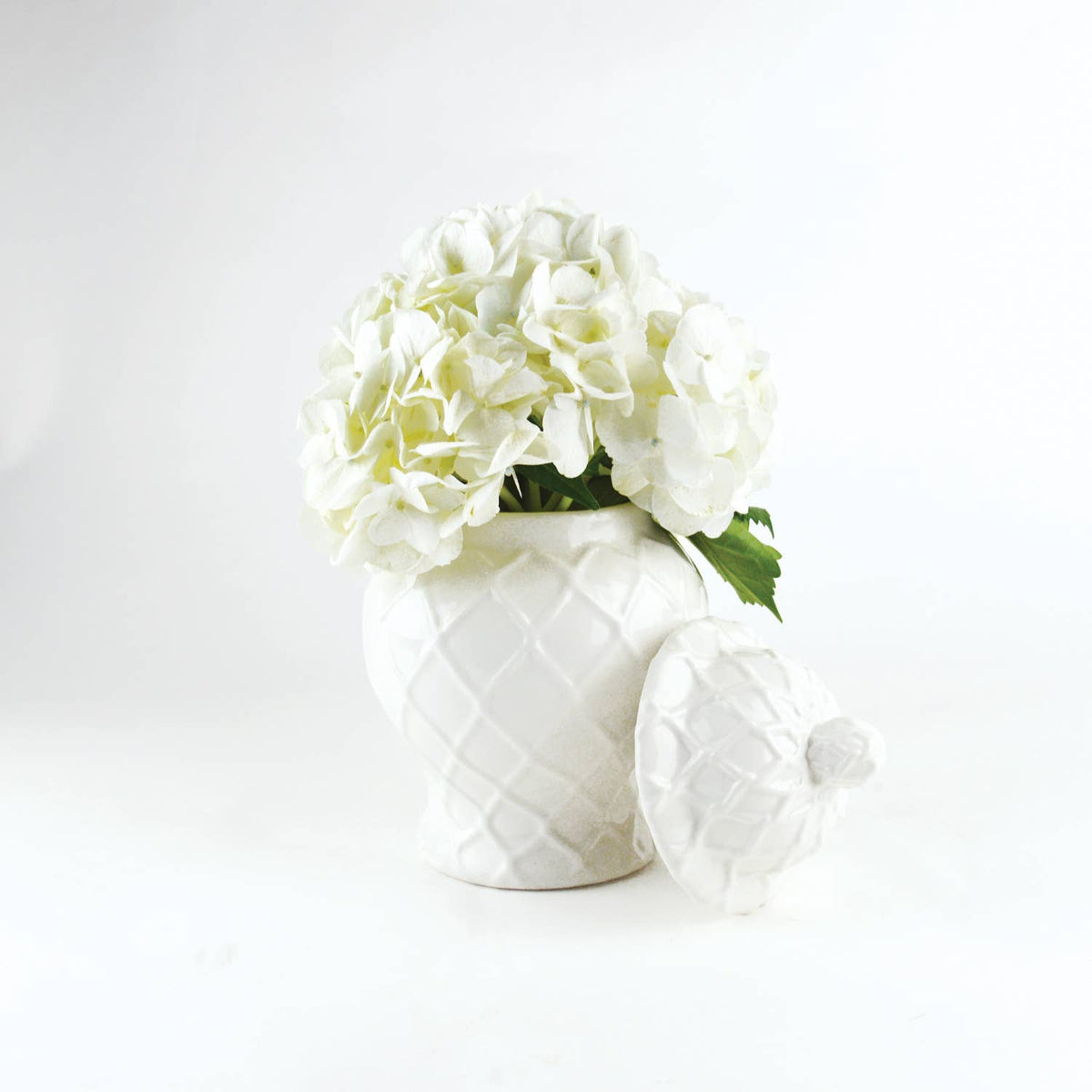 White textured ginger jar from Shop Holly J Home, showcasing three sizes with intricate surface details.