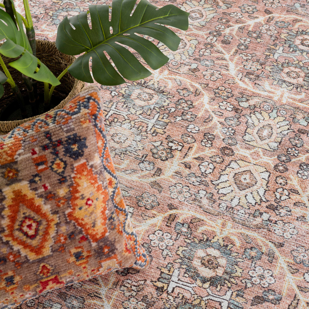 Hauteloom Urpi Rose and Brown washable area rug with floral design and soft texture.