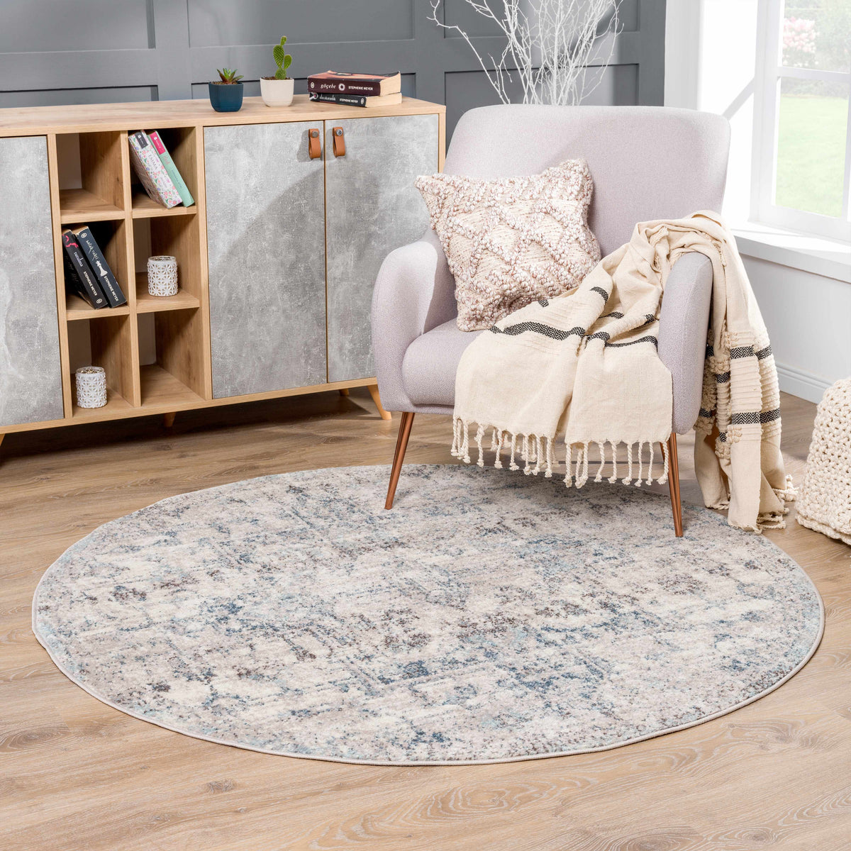 Orrick area rug by Boutique Rugs featuring a contemporary geometric pattern in neutral tones, shown in a cozy living room setting.