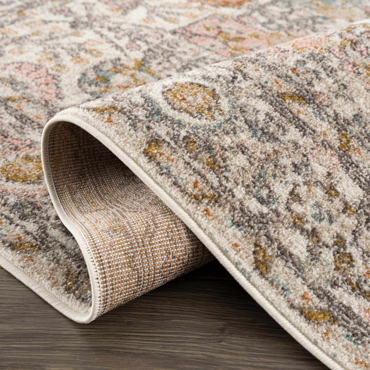 Folded Herstmonceux Area Rug by Boutique Rugs, showcasing textured design and soft fabric in neutral tones.