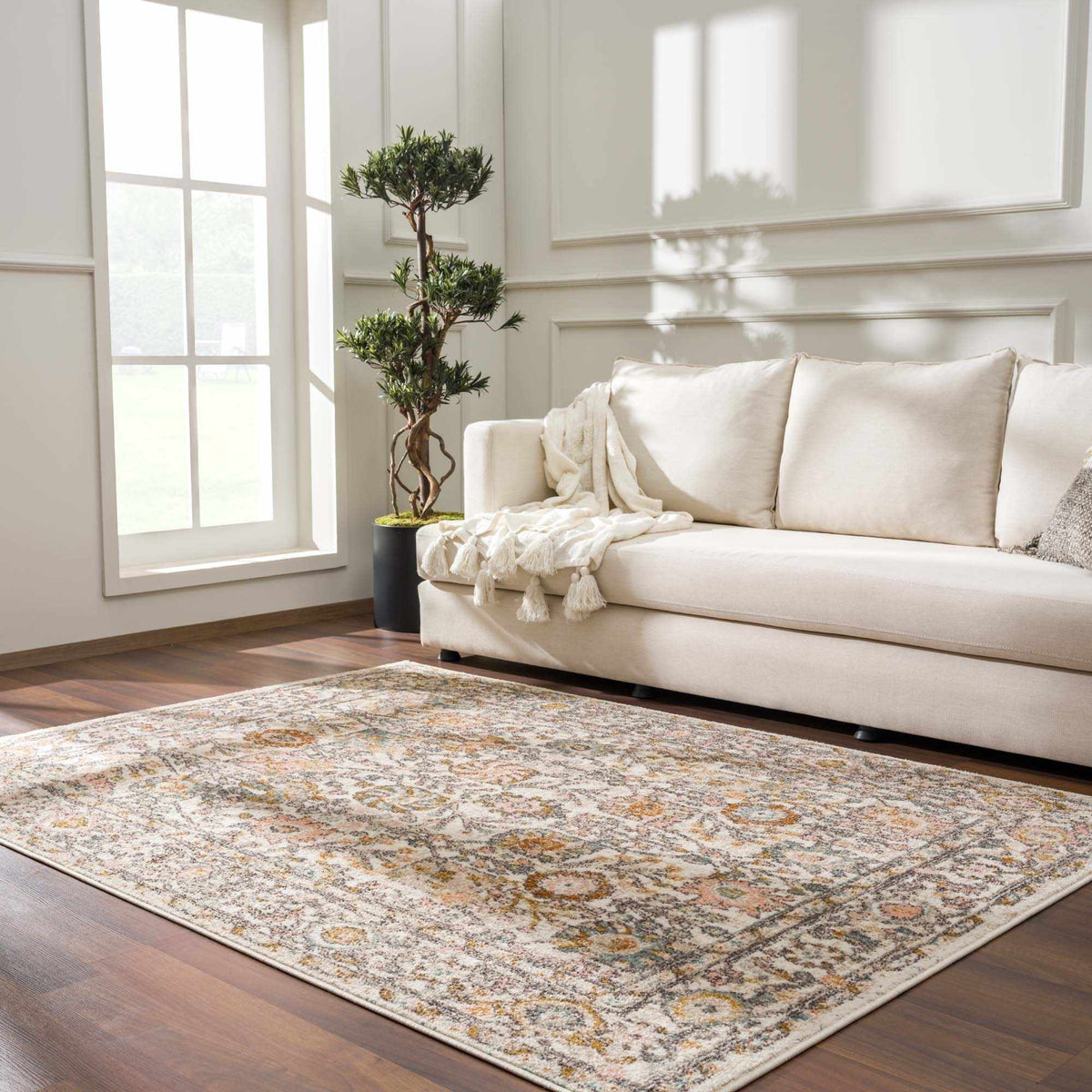 Herstmonceux area rug by Boutique Rugs displayed in a cozy living room setting with patterned design and neutral tones.