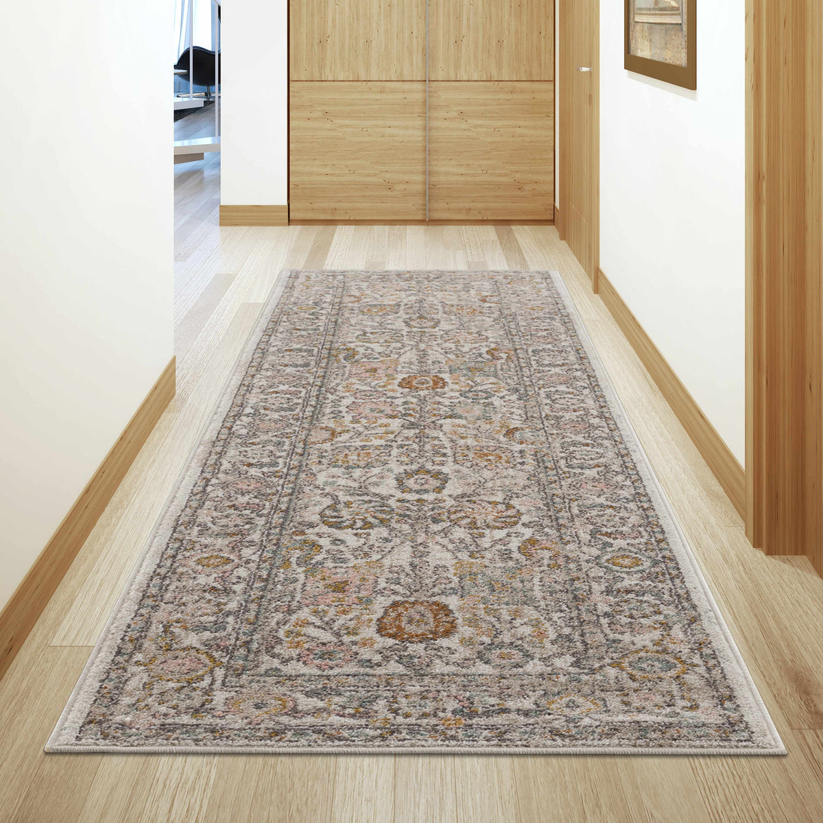 Herstmonceux area rug by Boutique Rugs, shown in a cozy room scene with intricate patterns and warm colors.