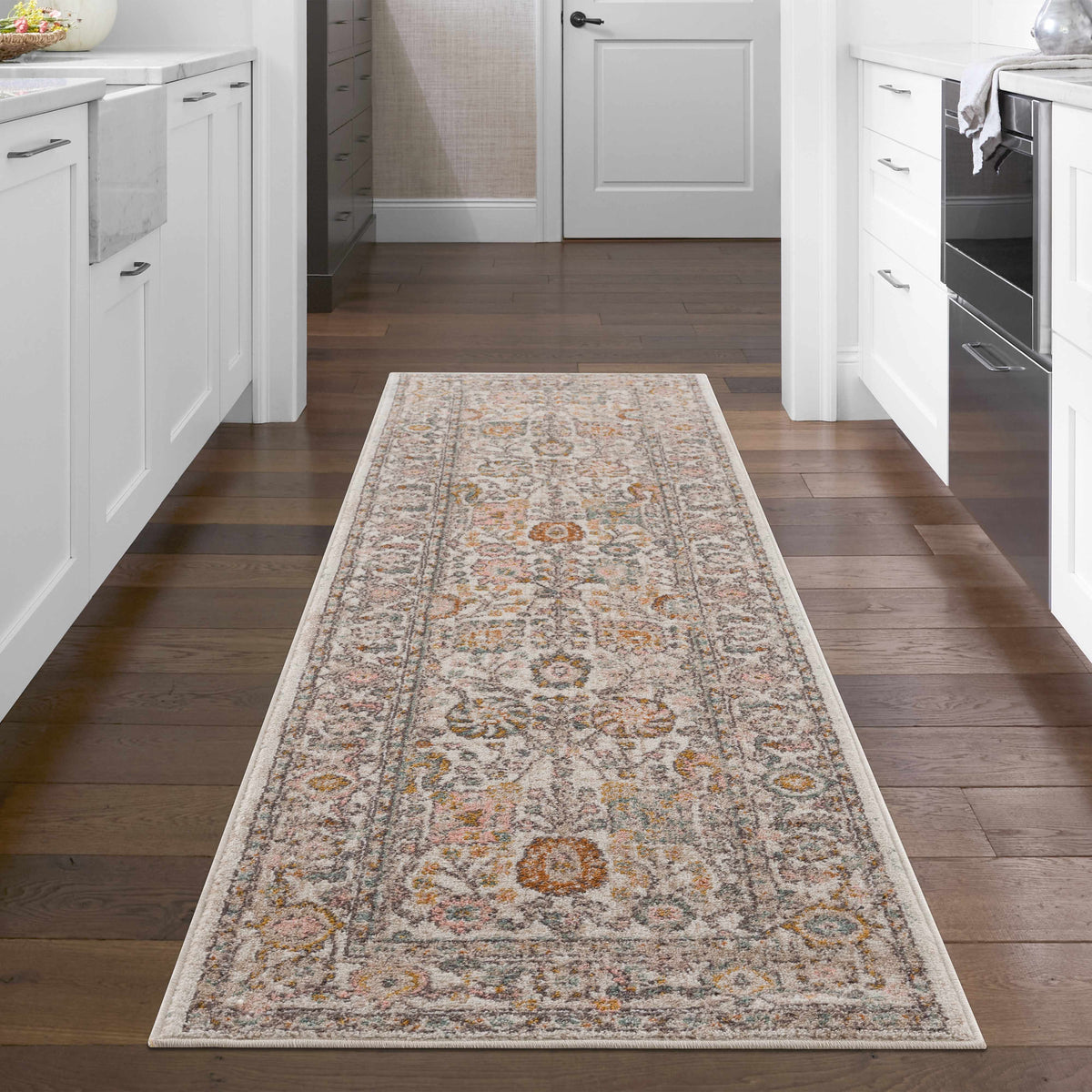 Herstmonceux area rug by Boutique Rugs displayed in a cozy living room setting with neutral tones and subtle pattern.