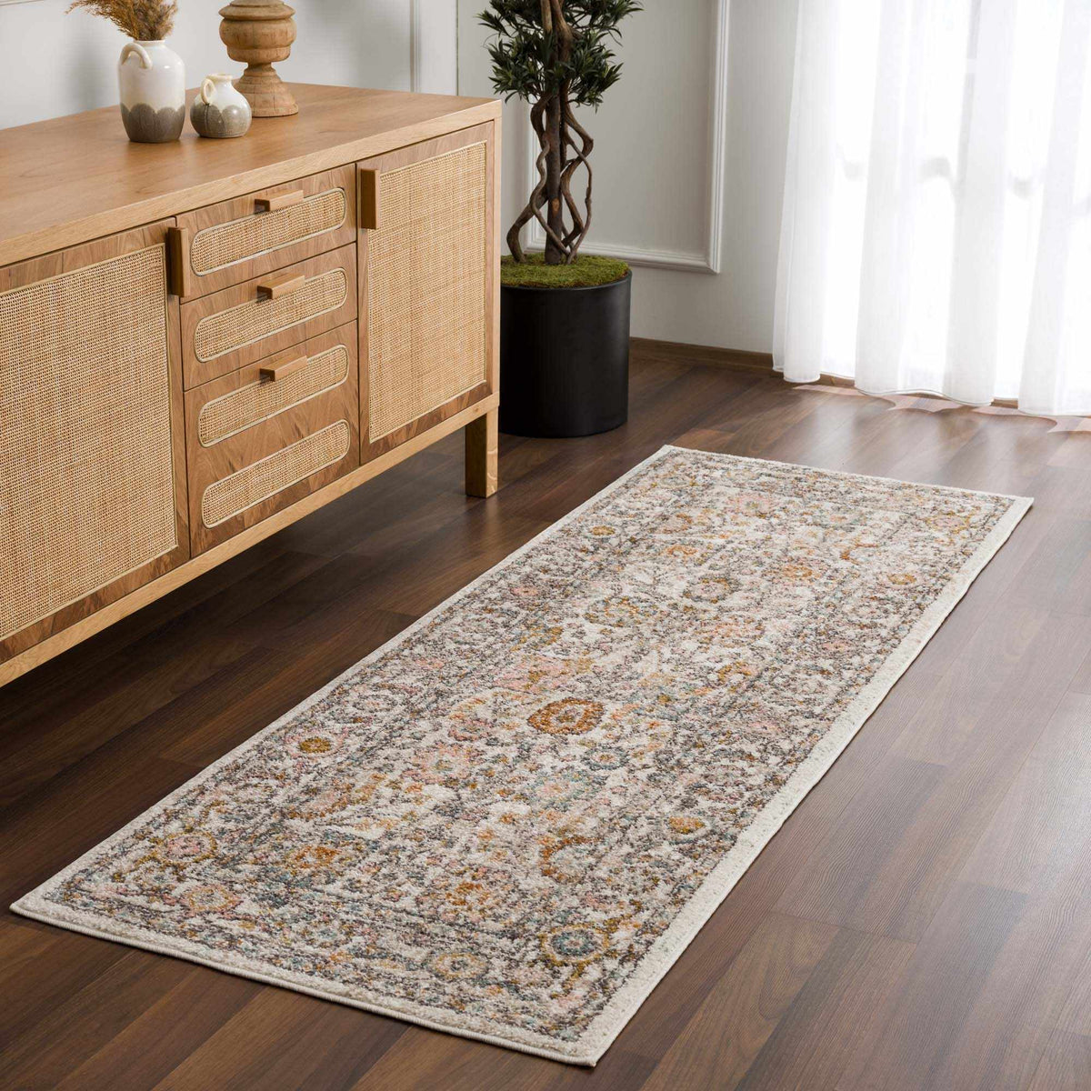 Herstmonceux area rug by Boutique Rugs shown in a room scene with intricate patterns and warm tones, perfect for living spaces.