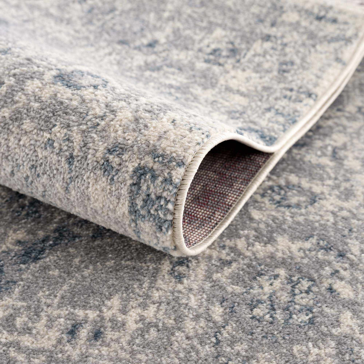 Hauteloom Peeta gray blue medallion area rug with intricate pattern, plush texture, and elegant design for living spaces.