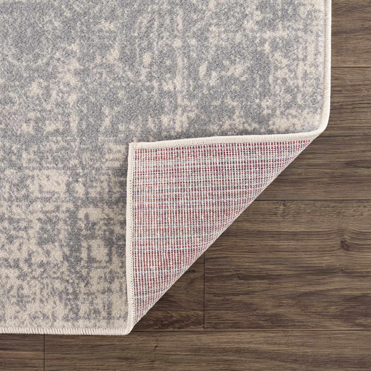 Hauteloom Peeta Gray Medallion Area Rug with intricate pattern, showcasing soft fabric and elegant design on a clean surface.