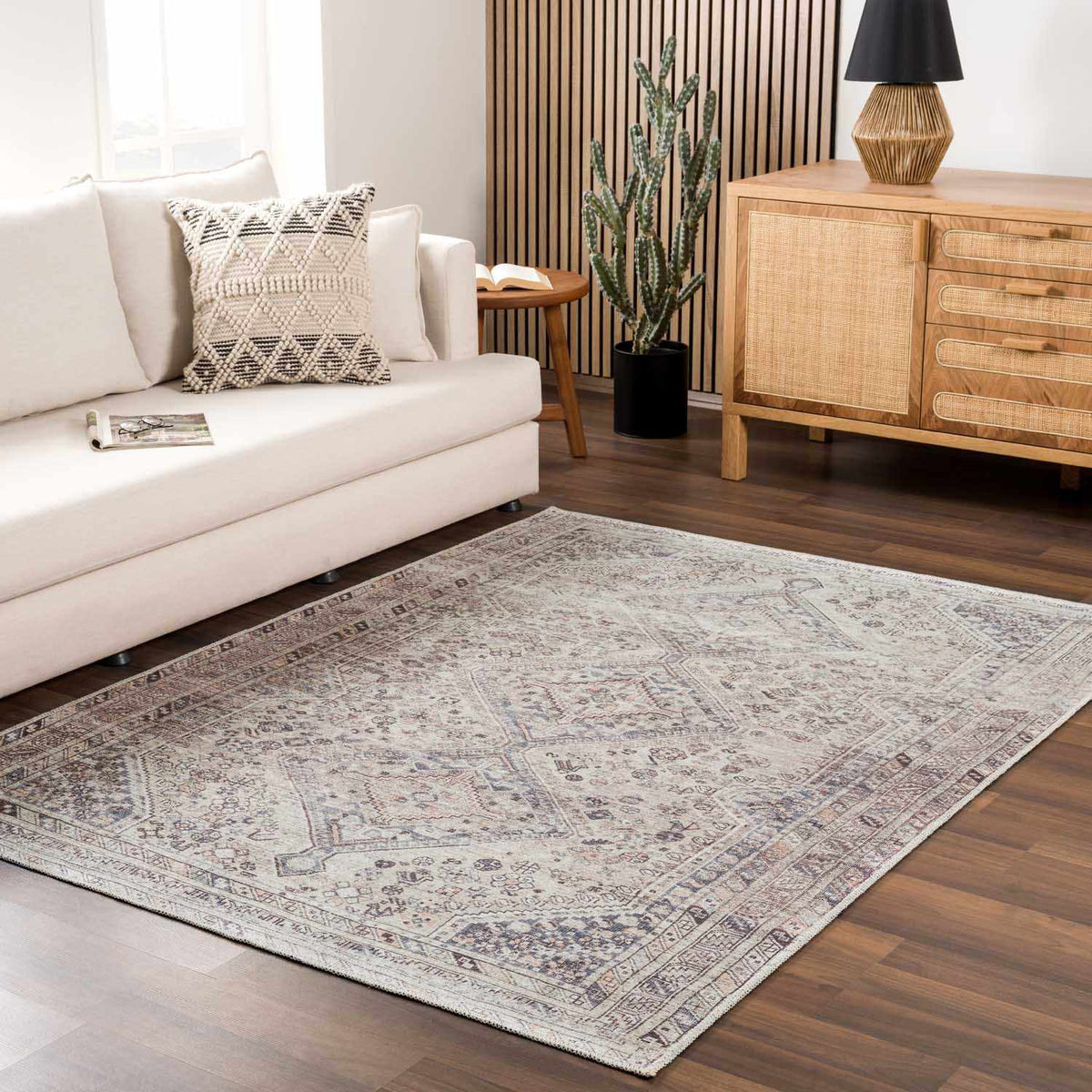 Barny Tan washable area rug by Boutique Rugs, shown in a cozy room setting with furniture and decor.
