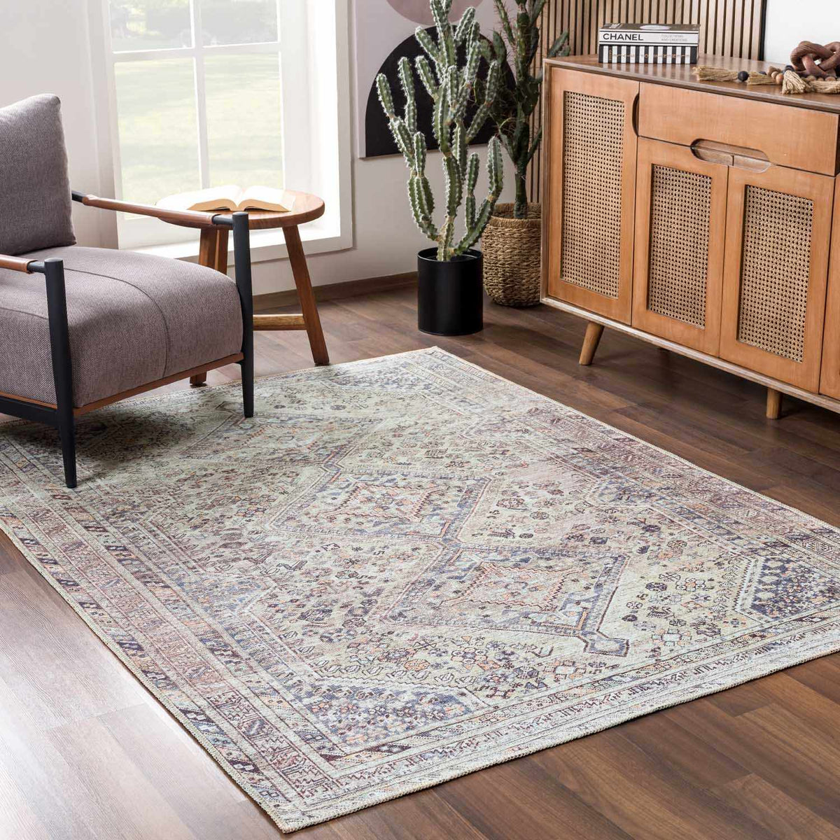 Barny Tan washable area rug by Boutique Rugs displayed in a cozy room setting with furniture and decor.