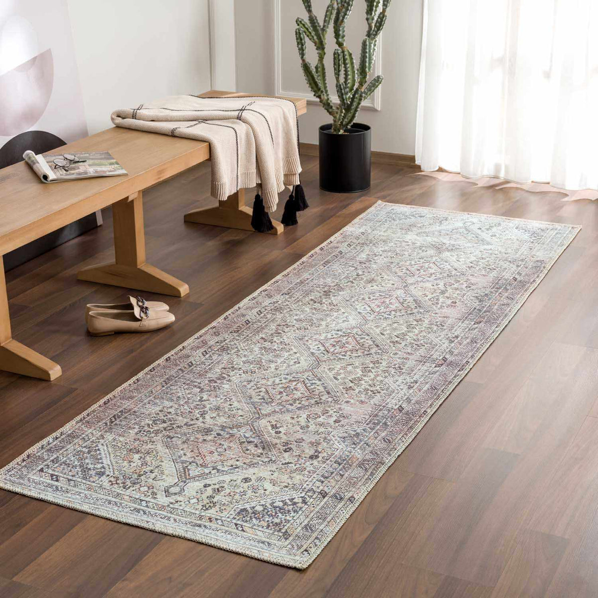 Barny Tan washable area rug by Boutique Rugs, shown in a room scene with a cozy, stylish design and soft textured surface.