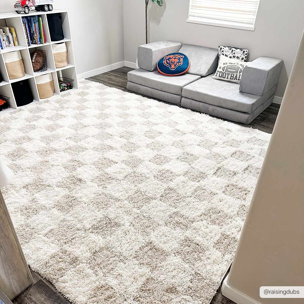Light brown checkered area rug by Boutique Rugs, 8x10 size, showcasing a stylish checkered pattern on a soft textured surface.