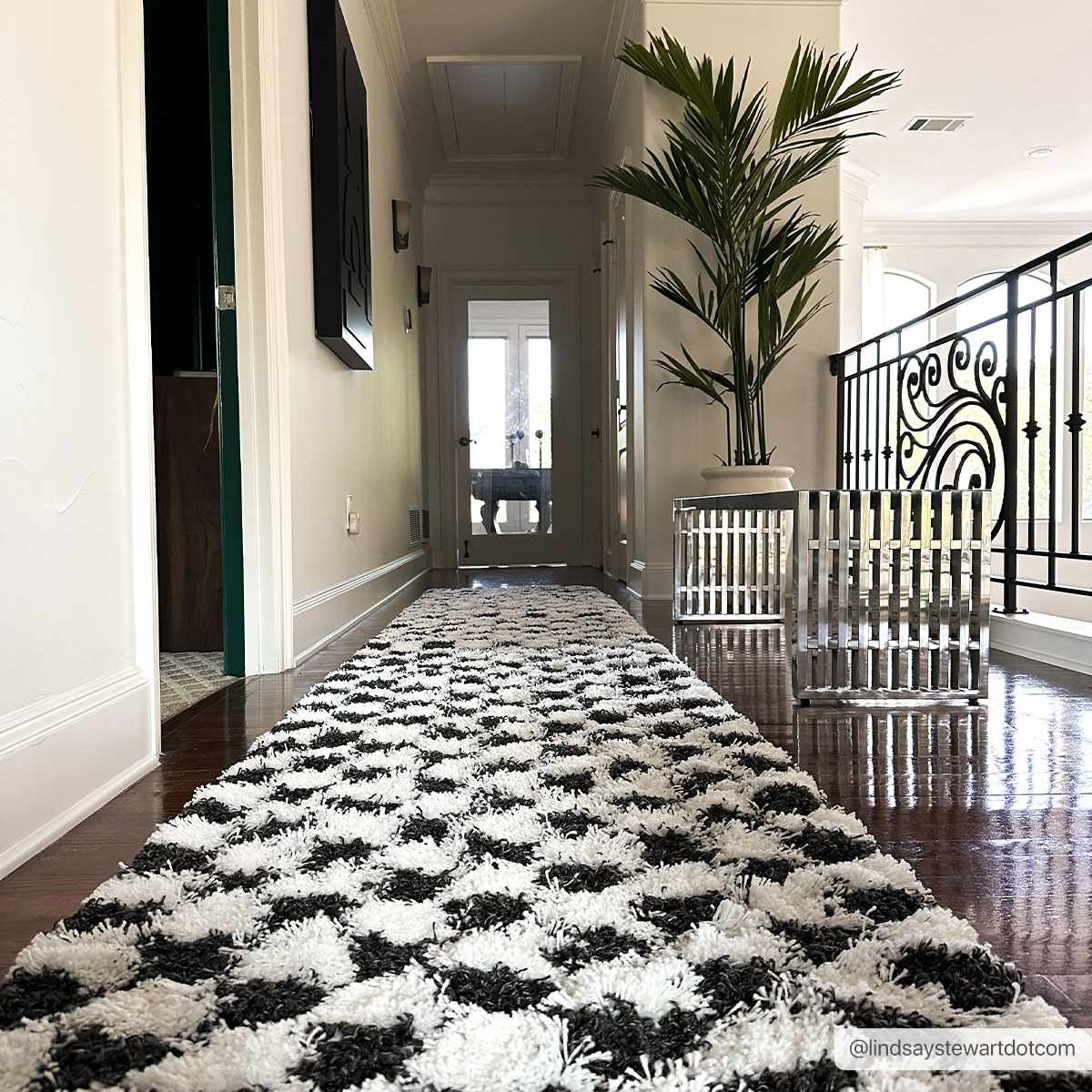 Black and white checkered area rug from Boutique Rugs, featuring a stylish pattern perfect for modern living spaces.