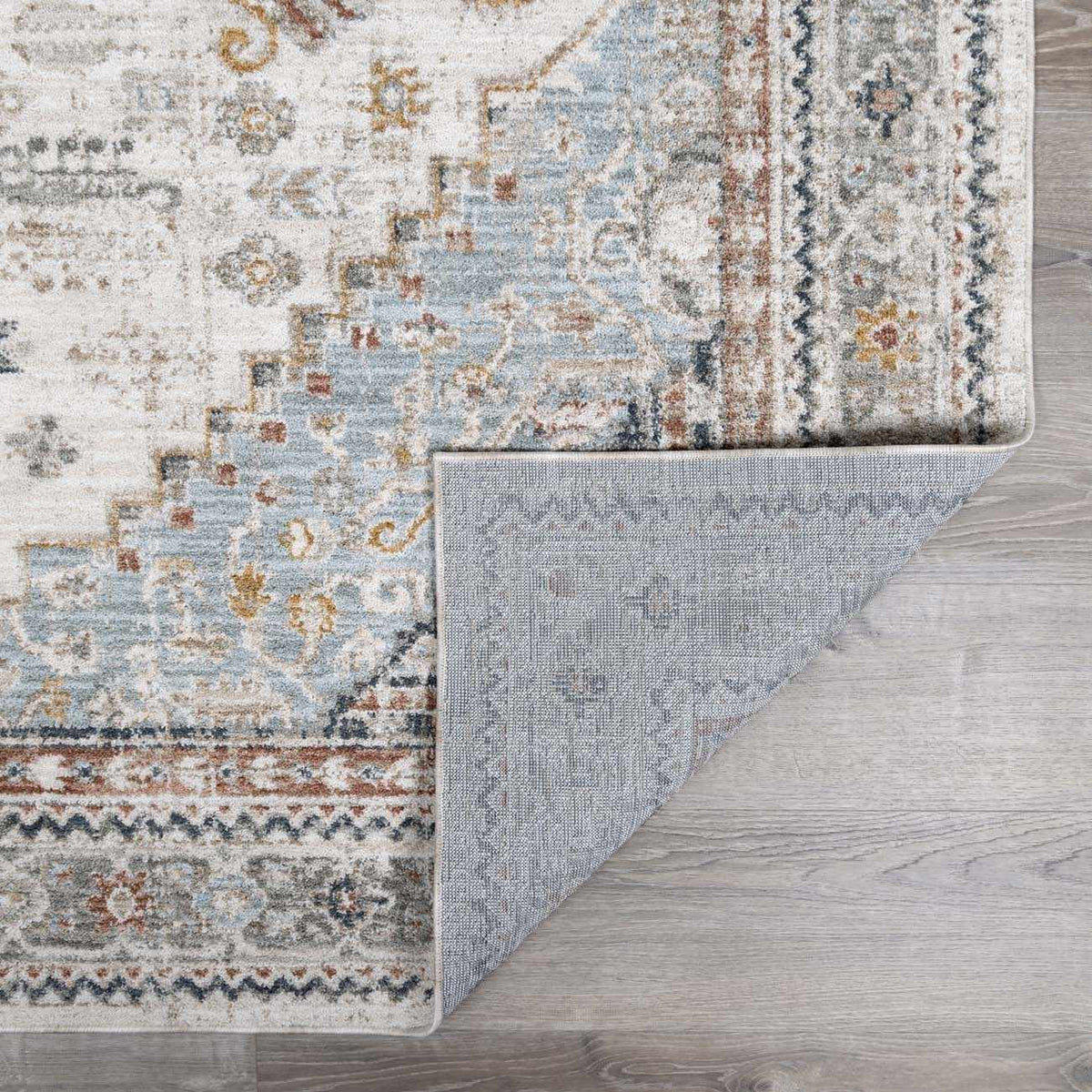 Folded Kouta Cream Area Rug by Boutique Rugs, showcasing soft texture and neutral cream color, perfect for modern living spaces.