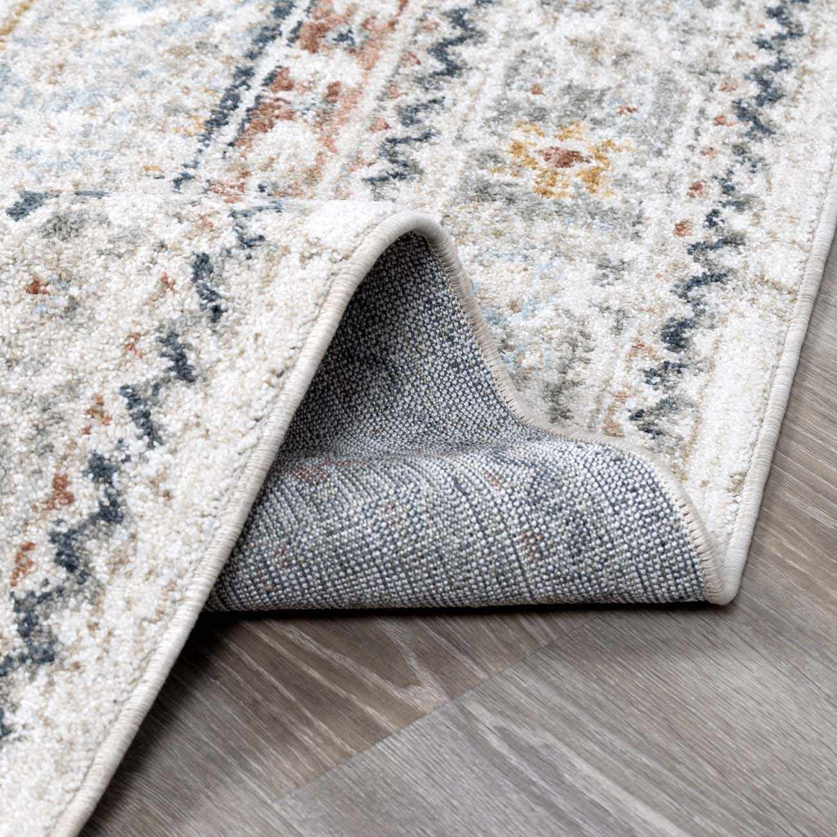 Folded Kouta Cream Area Rug by Boutique Rugs showing soft, plush fabric and neutral cream color suitable for modern living spaces.