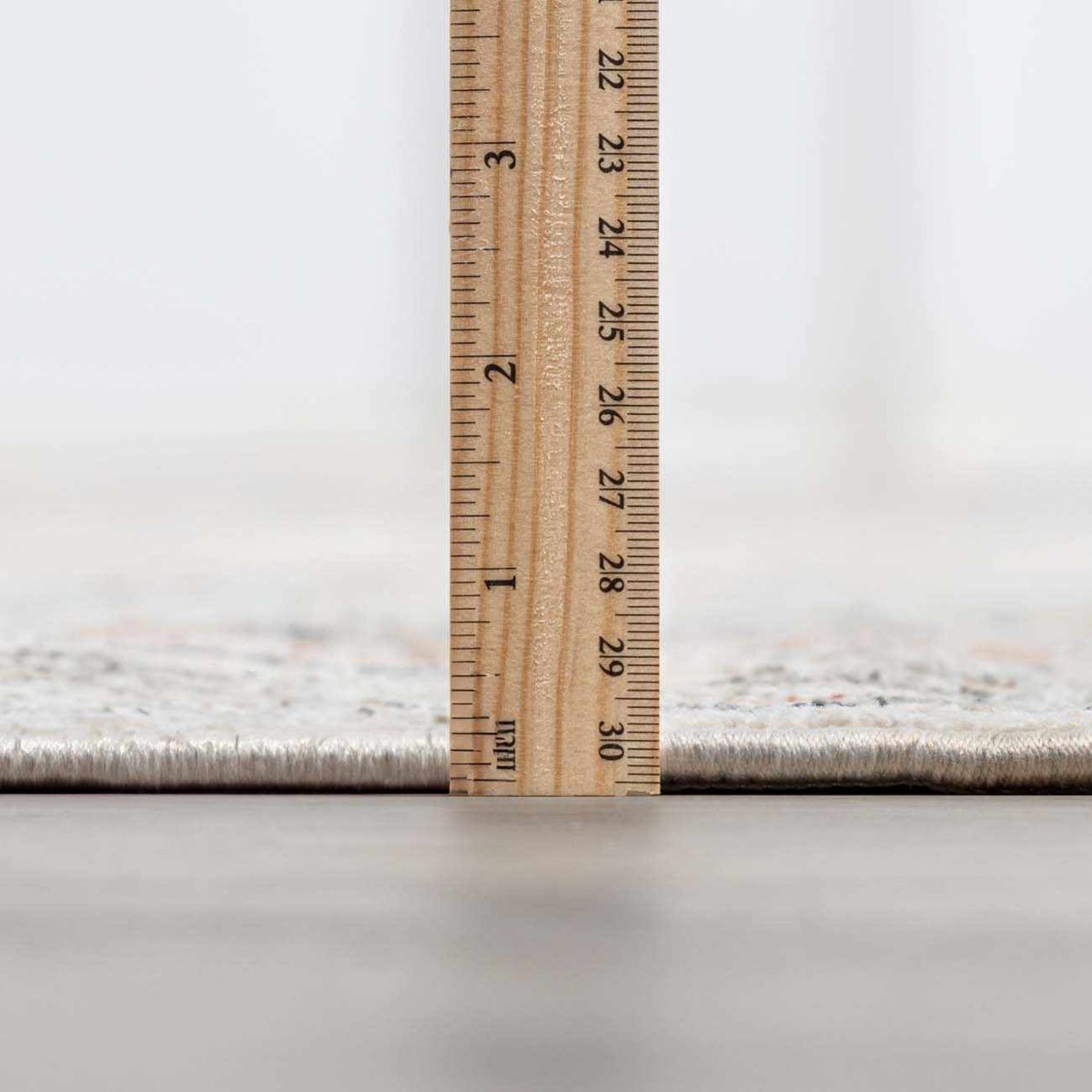 Close-up of the Kouta Cream Area Rug by Boutique Rugs, showcasing its textured pile in a neutral cream color.