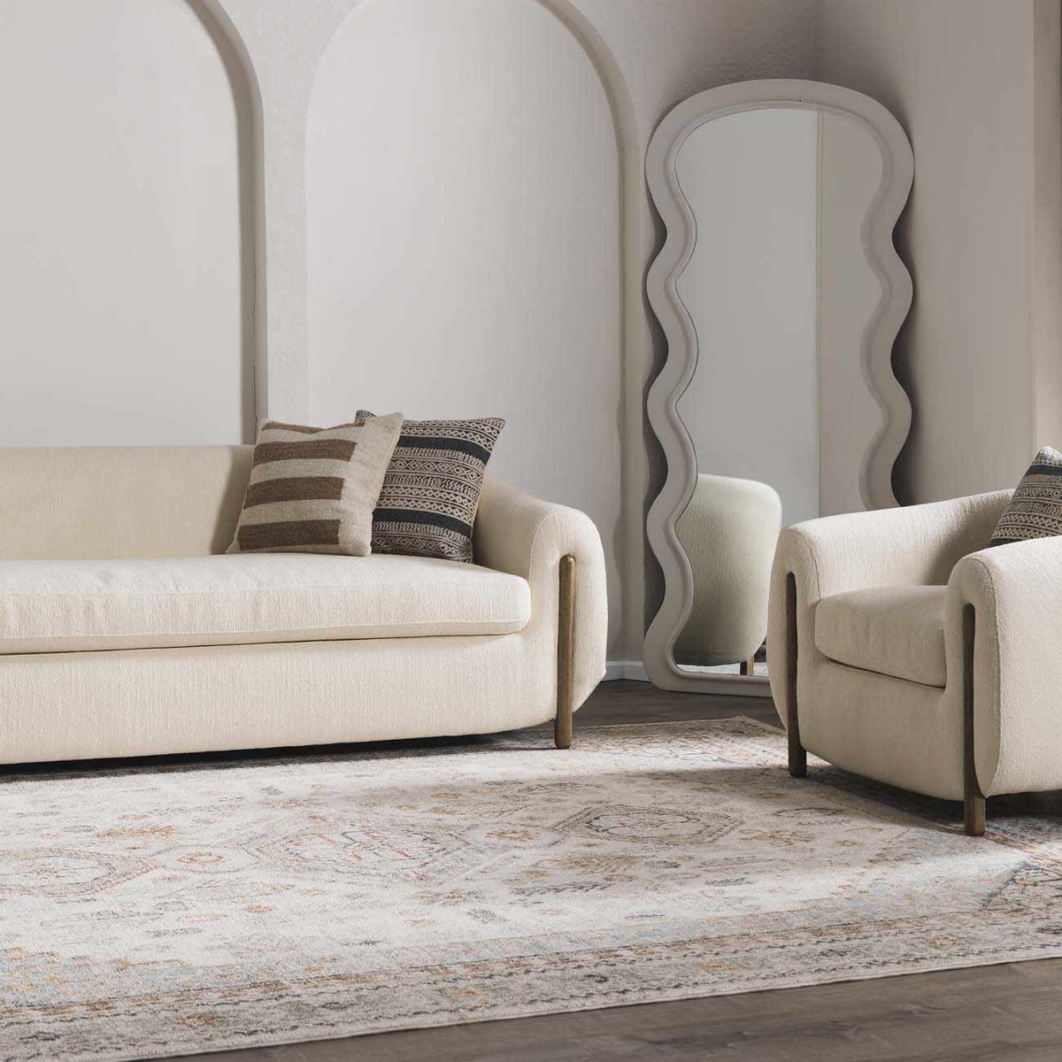 Kouta Cream Area Rug by Boutique Rugs, displayed in a cozy living room setting with soft cream tones and intricate pattern details.