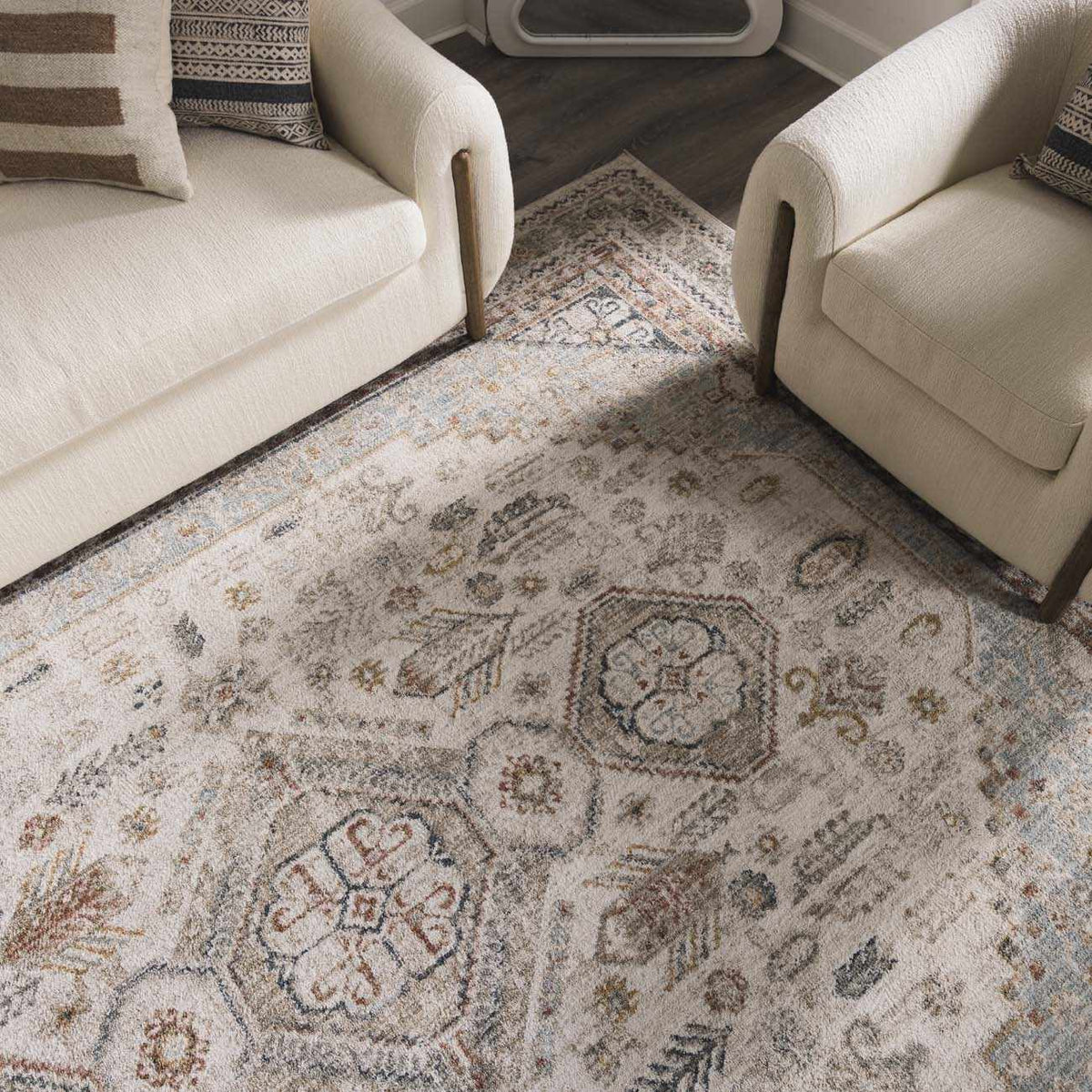 Kouta Cream area rug by Boutique Rugs shown in a cozy room setting with furniture and decor accents.