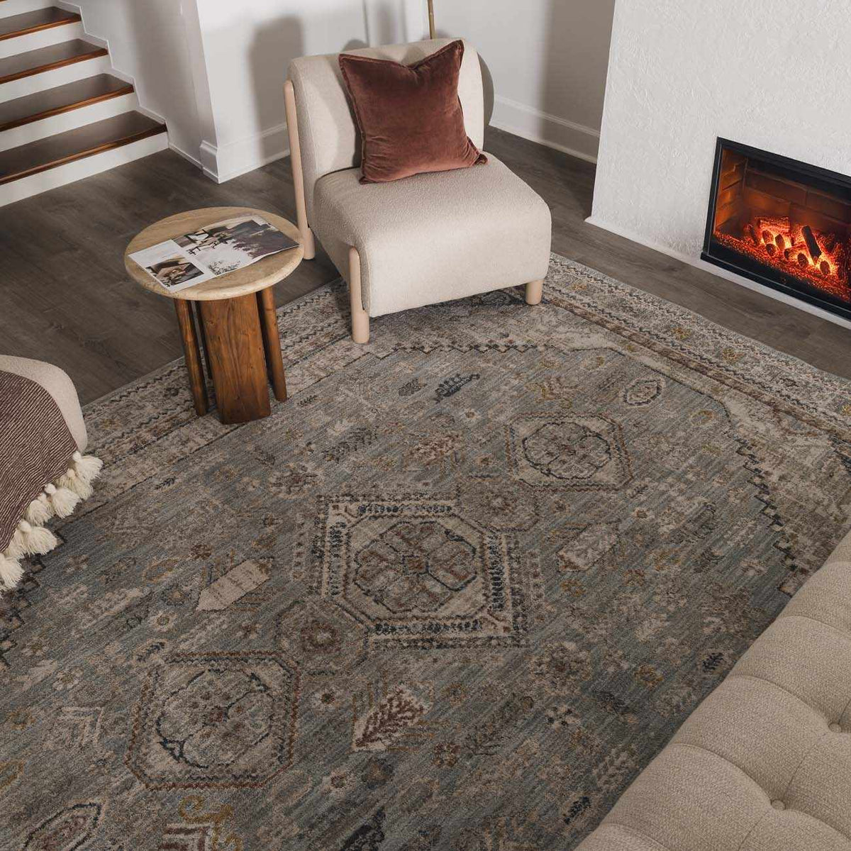 Gray and blue Kouta area rug by Boutique Rugs, showcasing a modern design in a cozy room setting.