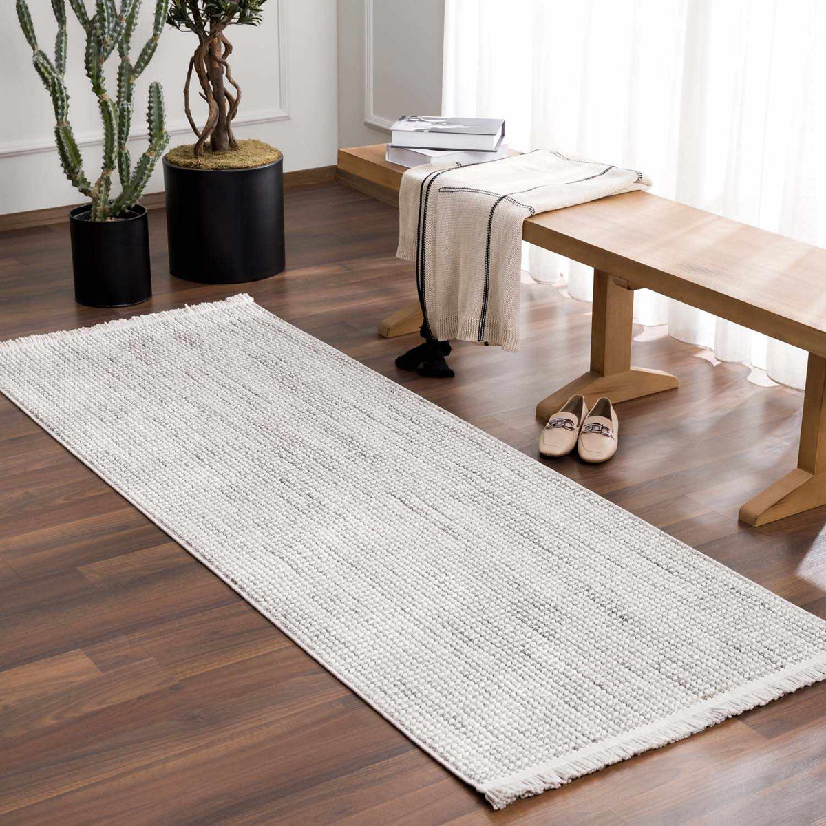 Gowan Cream Area Rug by Boutique Rugs, featuring a soft cream color and intricate pattern, shown in a cozy room setting.