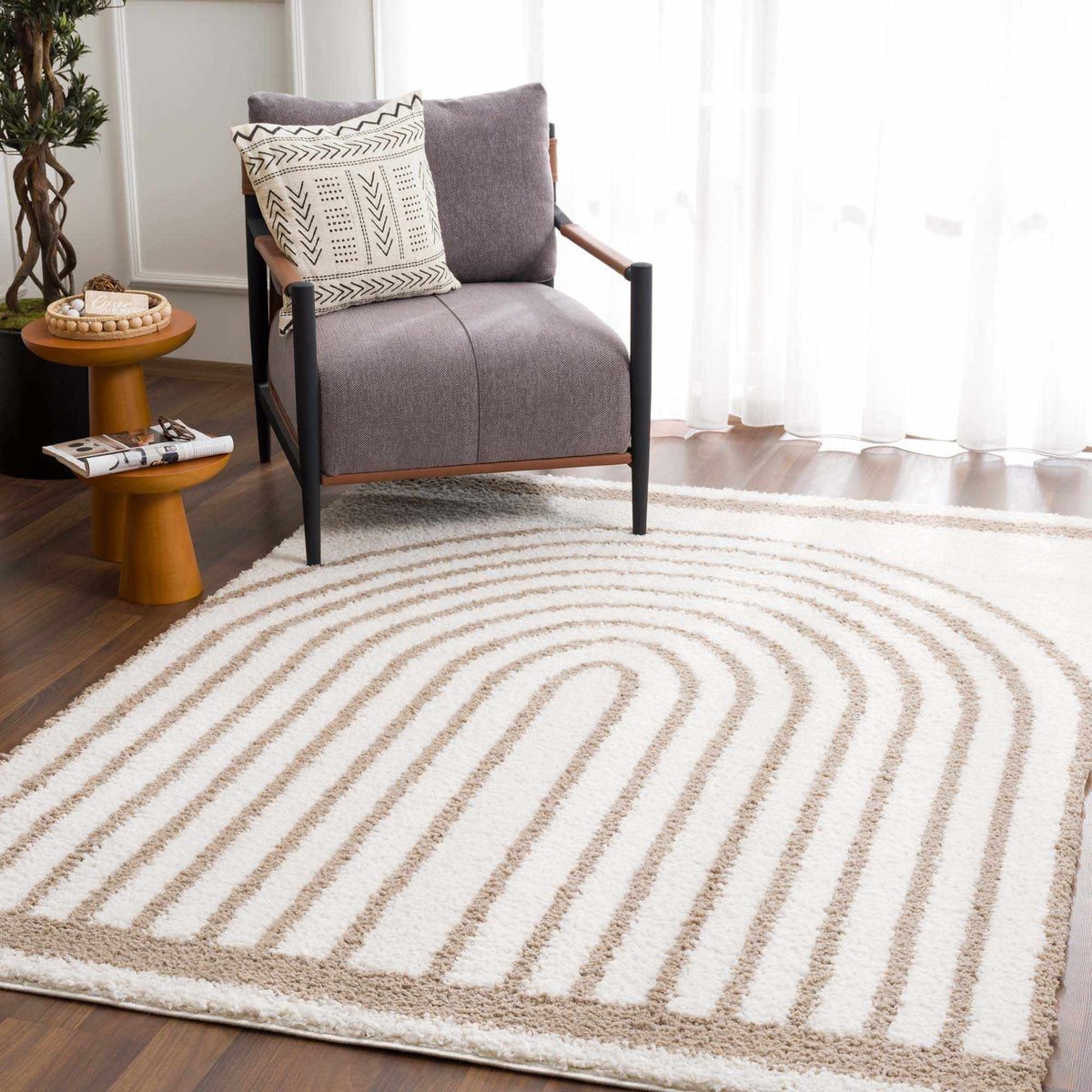 Jola beige area rug by Boutique Rugs displayed in a room setting with furniture and decor, showcasing a soft, neutral rug design.