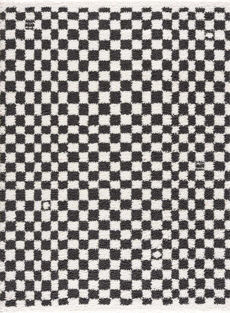 Black and white checkered shag rug by Boutique Rugs, featuring a plush, textured surface with bold geometric pattern.