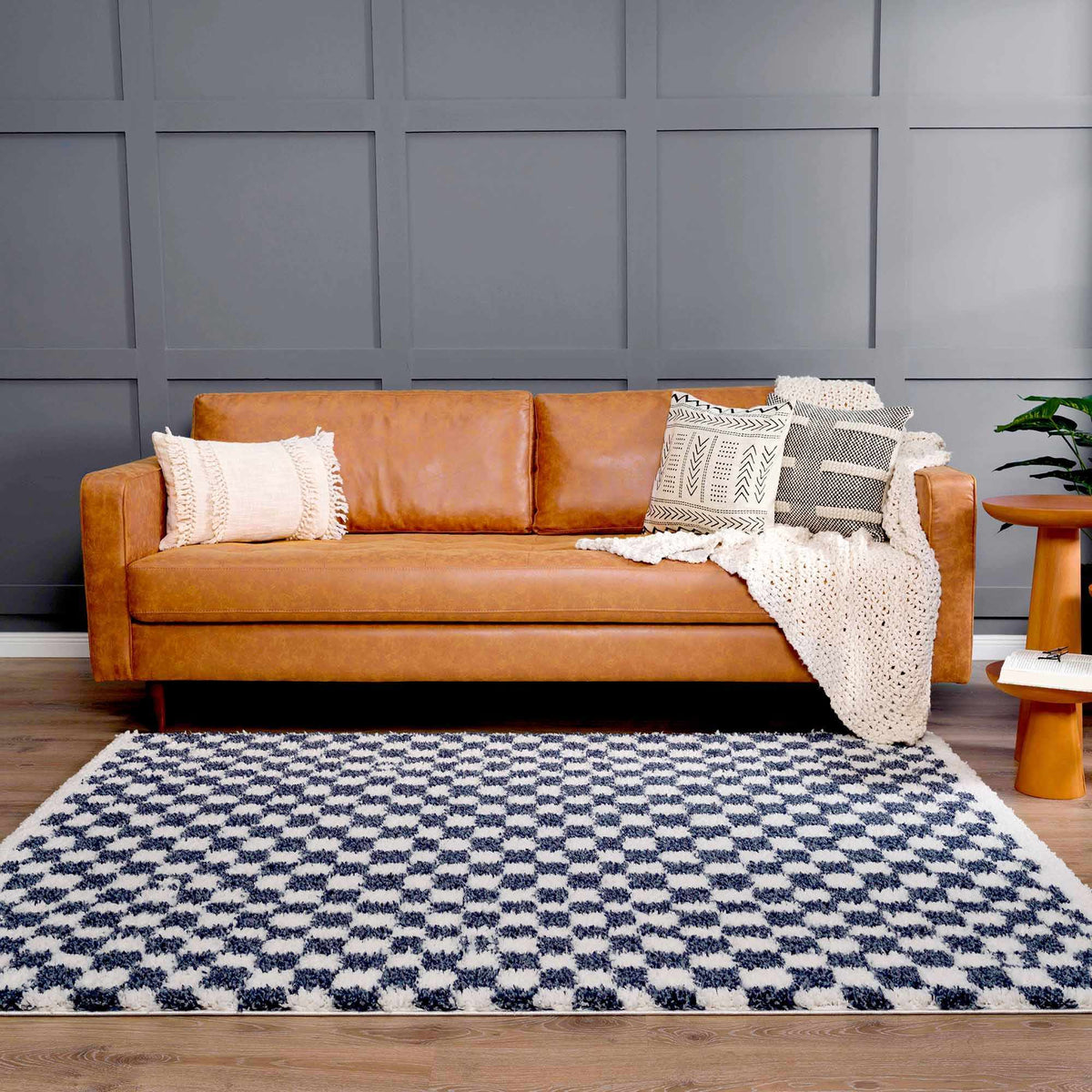 Blue and white checkered area rug by Boutique Rugs, showcasing a stylish checkered pattern in a modern room setting.