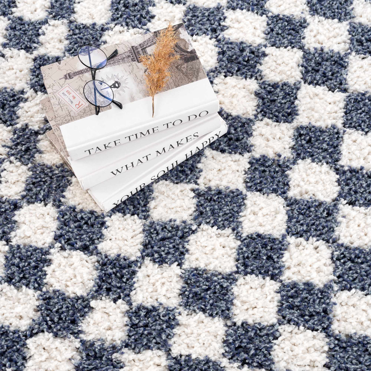 Blue and white checkered area rug by Boutique Rugs, featuring a stylish geometric pattern and soft woven texture.