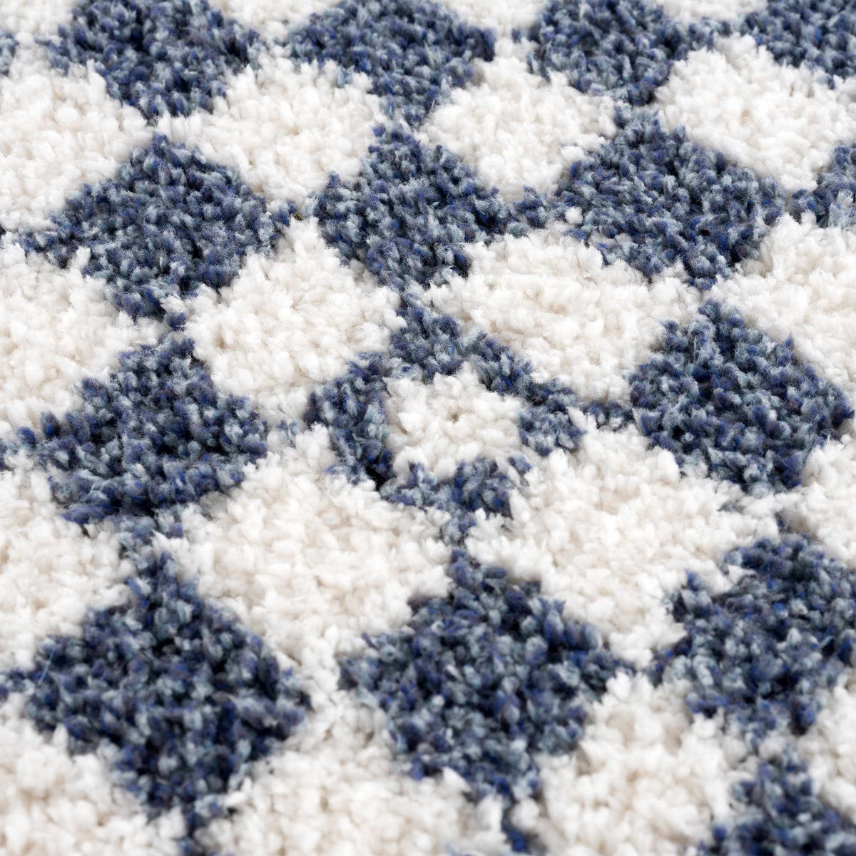 Blue and white checkered area rug by Boutique Rugs, featuring a textured pattern and soft fabric in a modern design.