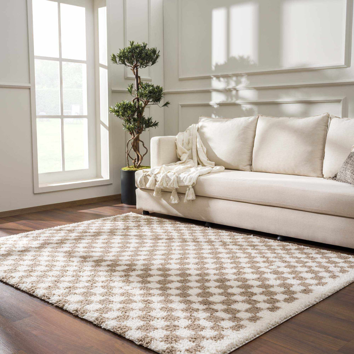 Taupe checkered shag rug by Boutique Rugs shown in a cozy living room setting, highlighting soft texture and modern pattern.