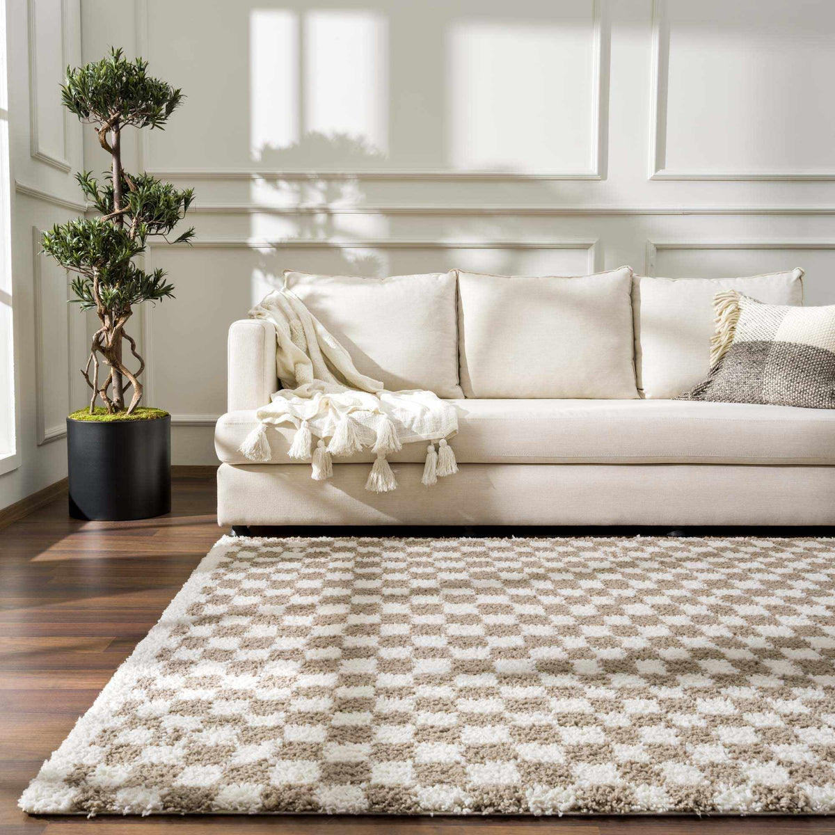 Taupe checkered shag rug by Boutique Rugs, styled in a cozy room scene, showcasing soft texture and modern woven pattern.