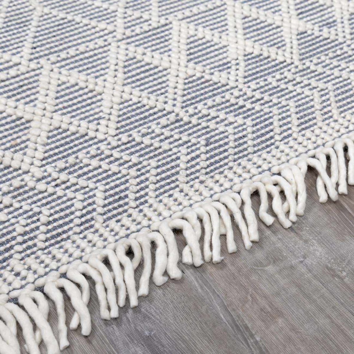 Blue Wool Rug from Ramsbury Denim collection by Boutique Rugs, showing a textured pile and intricate woven design.