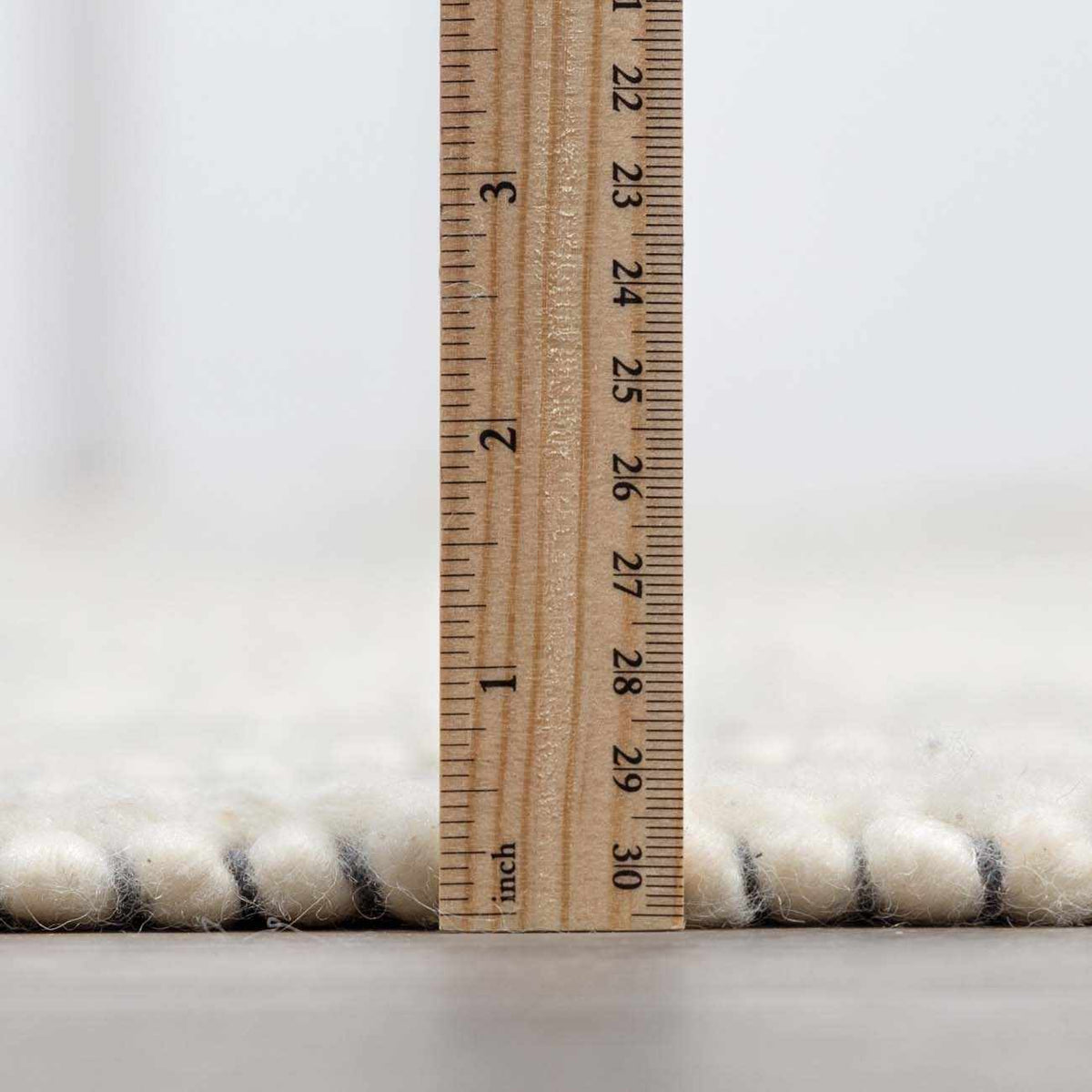 Blue wool rug from Ramsbury Denim collection by Boutique Rugs, showing a textured pile with a soft, plush appearance.