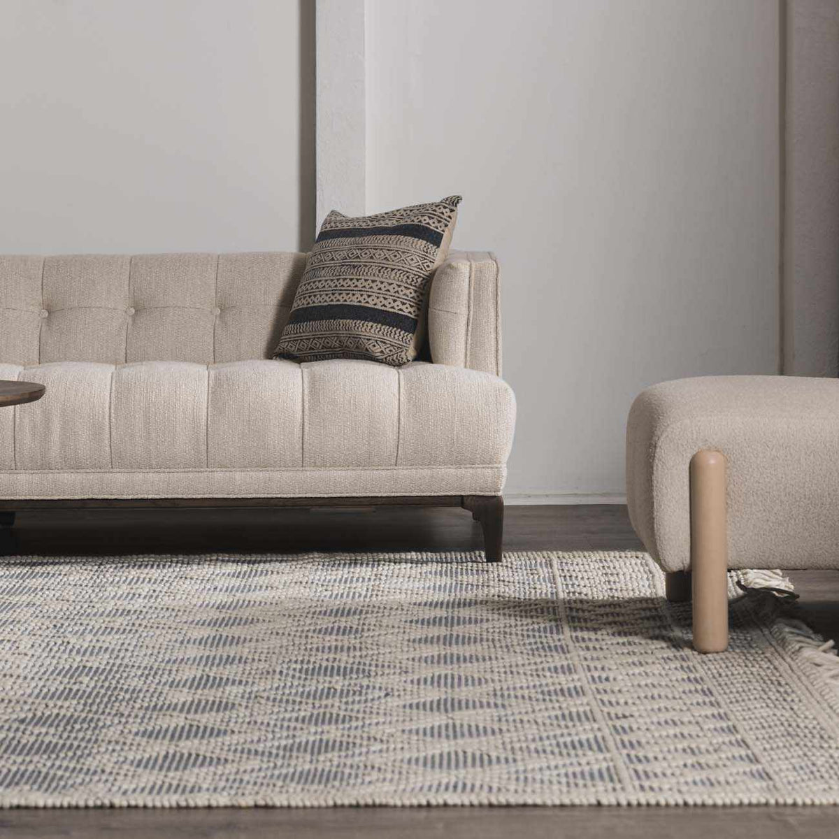 Blue Wool Rug by Boutique Rugs with Ramsbury Denim design, shown in a cozy room setting featuring intricate patterns and soft texture.