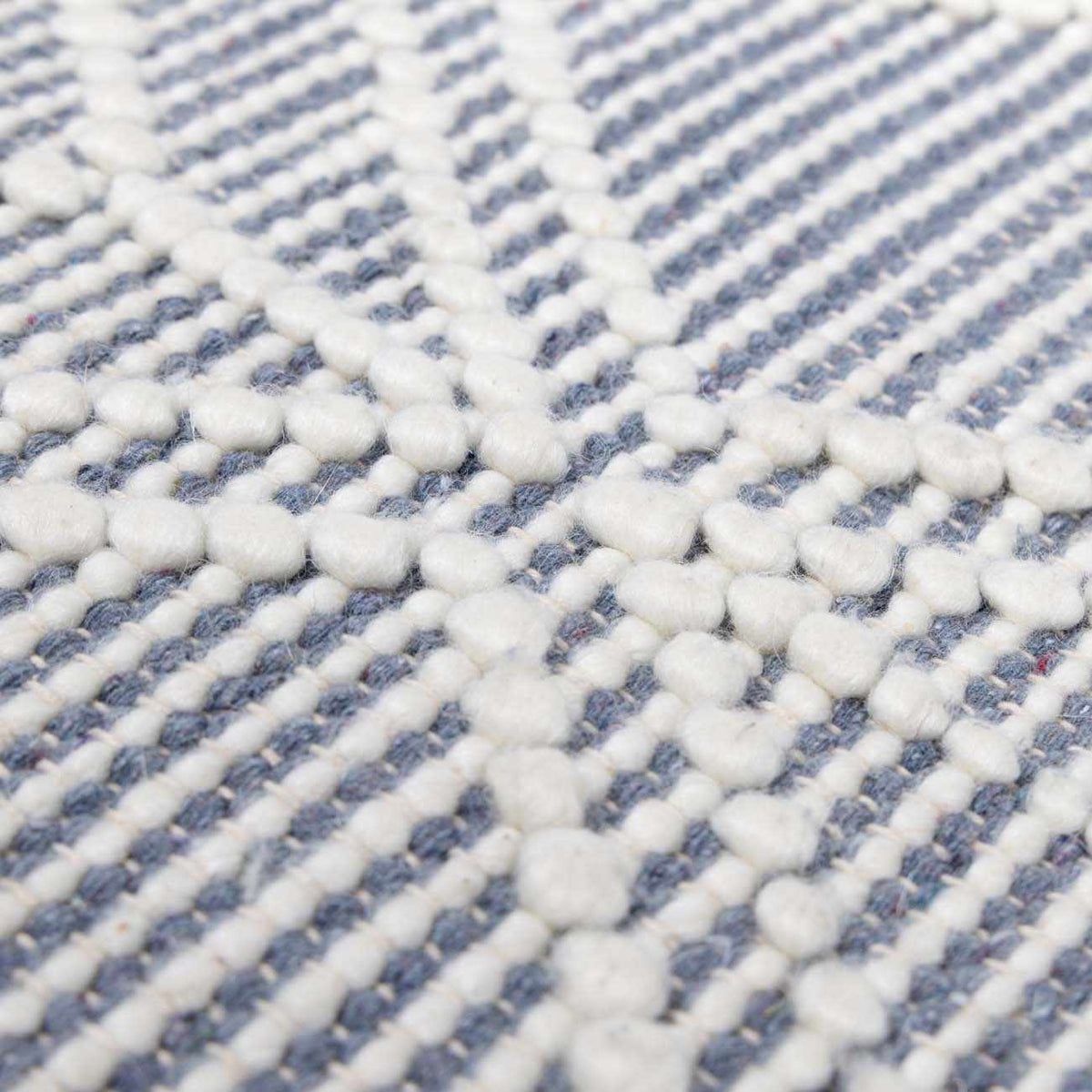 Blue Wool Rug from Ramsbury Denim collection by Boutique Rugs featuring textured wool fabric and intricate weave pattern.