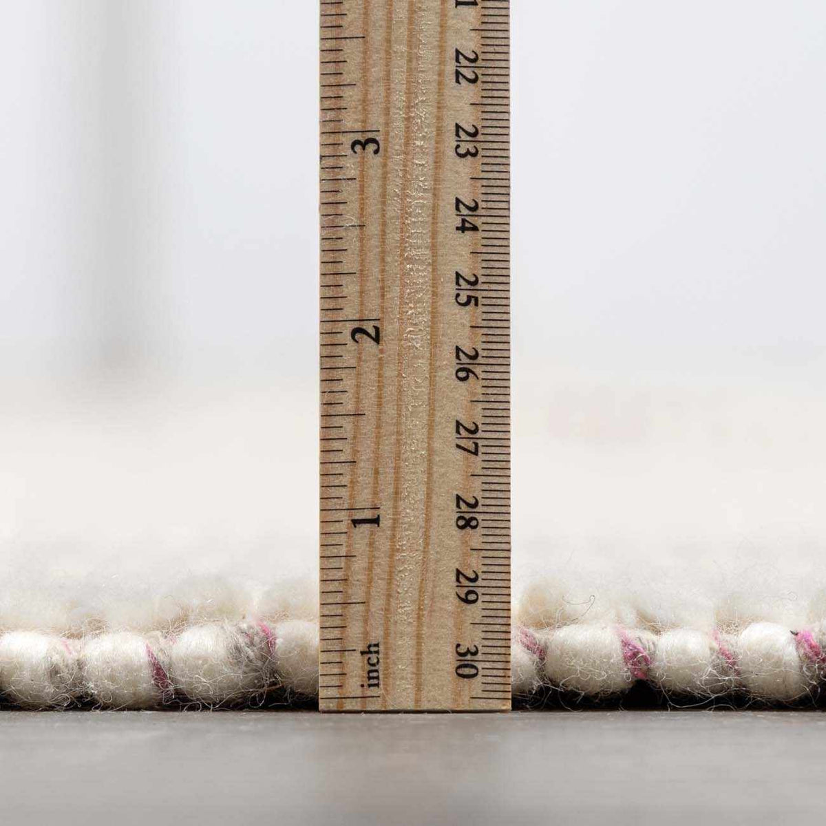 Soft pink wool rug from Boutique Rugs, featuring a plush pile and elegant design, perfect for cozy interior decor.