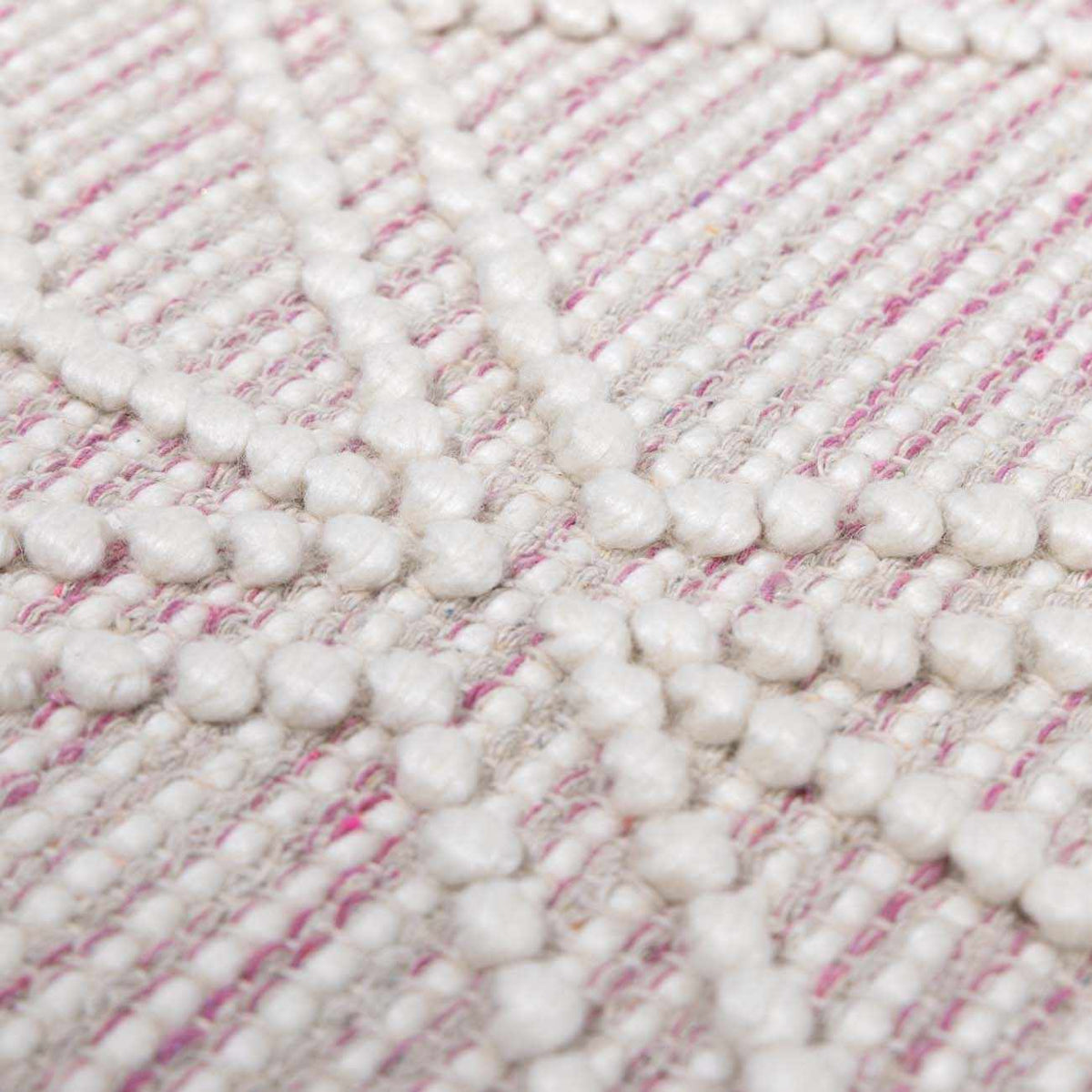 Soft pink wool rug by Boutique Rugs featuring textured surface and plush pile, ideal for cozy living spaces.