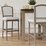 Carolina Barstool Wilmington stool in natural gray wood with a modern design, shown in a stylish bar room setting.