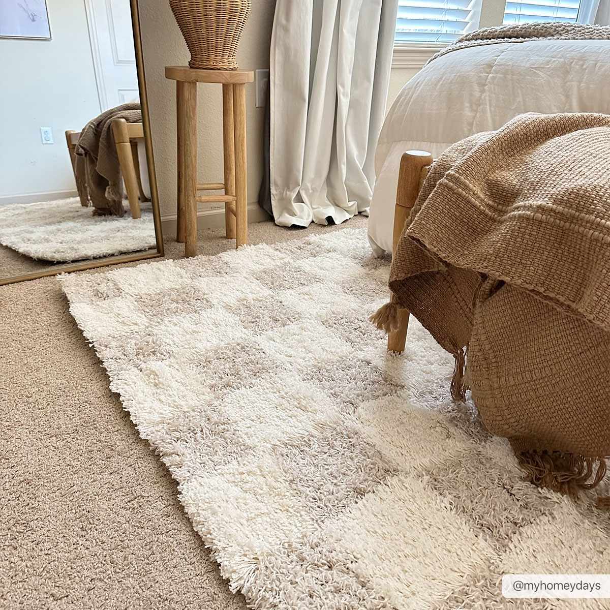 Light brown checkered area rug from Boutique Rugs, 7x10 size with a cream and checkered pattern, perfect for living rooms or bedrooms.