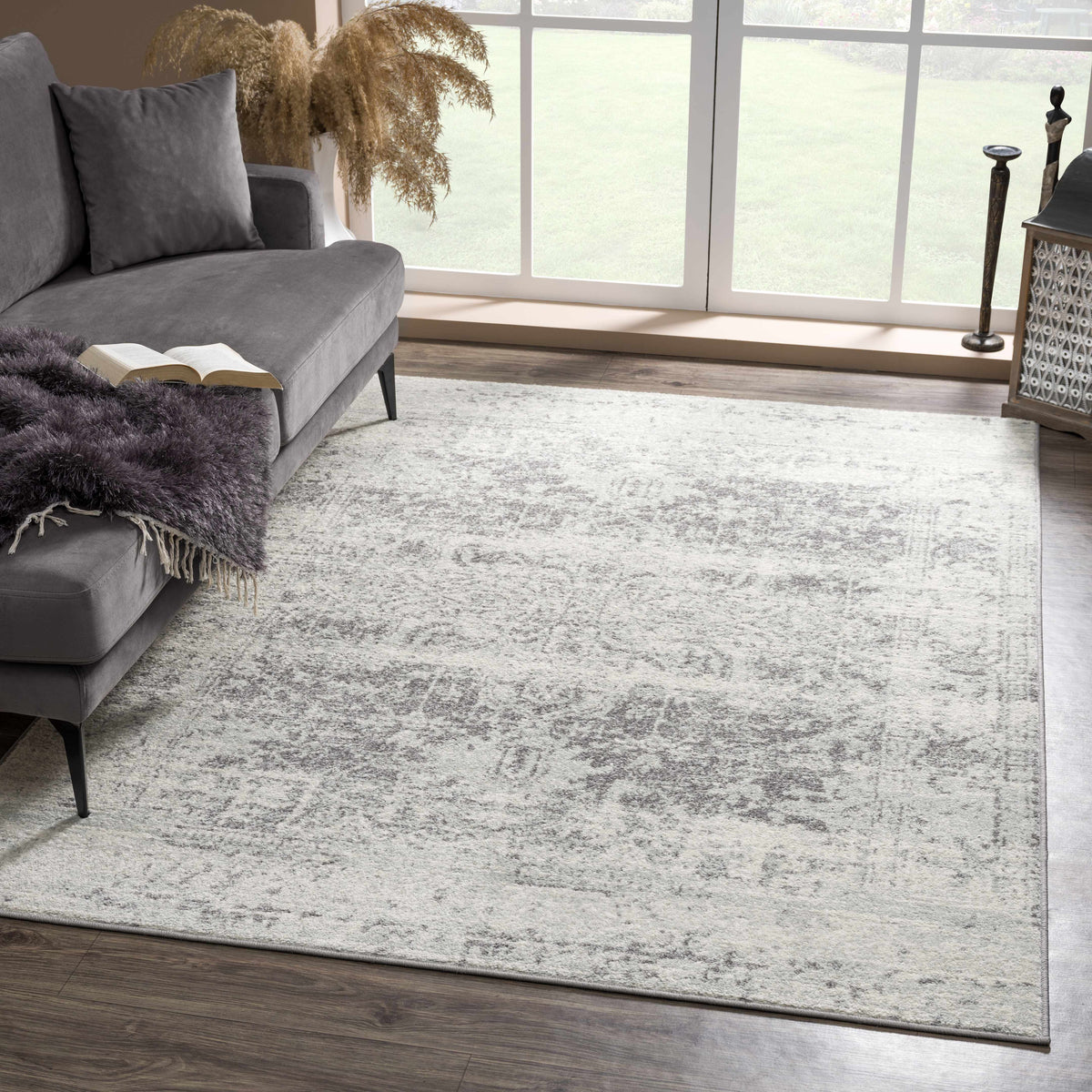 Hauteloom Rachel area rug with intricate geometric patterns in neutral tones, showcasing soft woven texture and modern design.