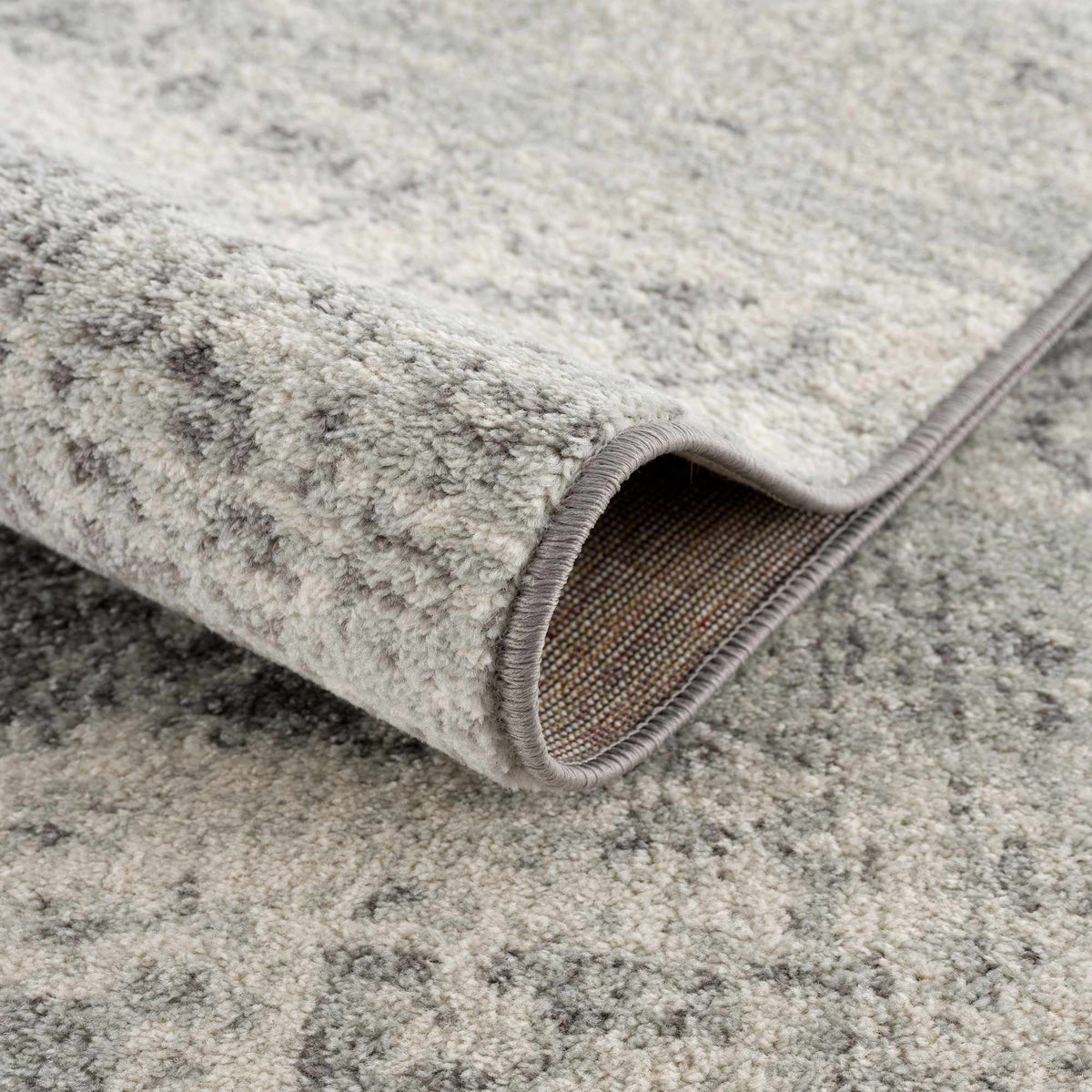 Hauteloom Rachel area rug featuring a modern geometric pattern in neutral tones, perfect for contemporary living spaces.