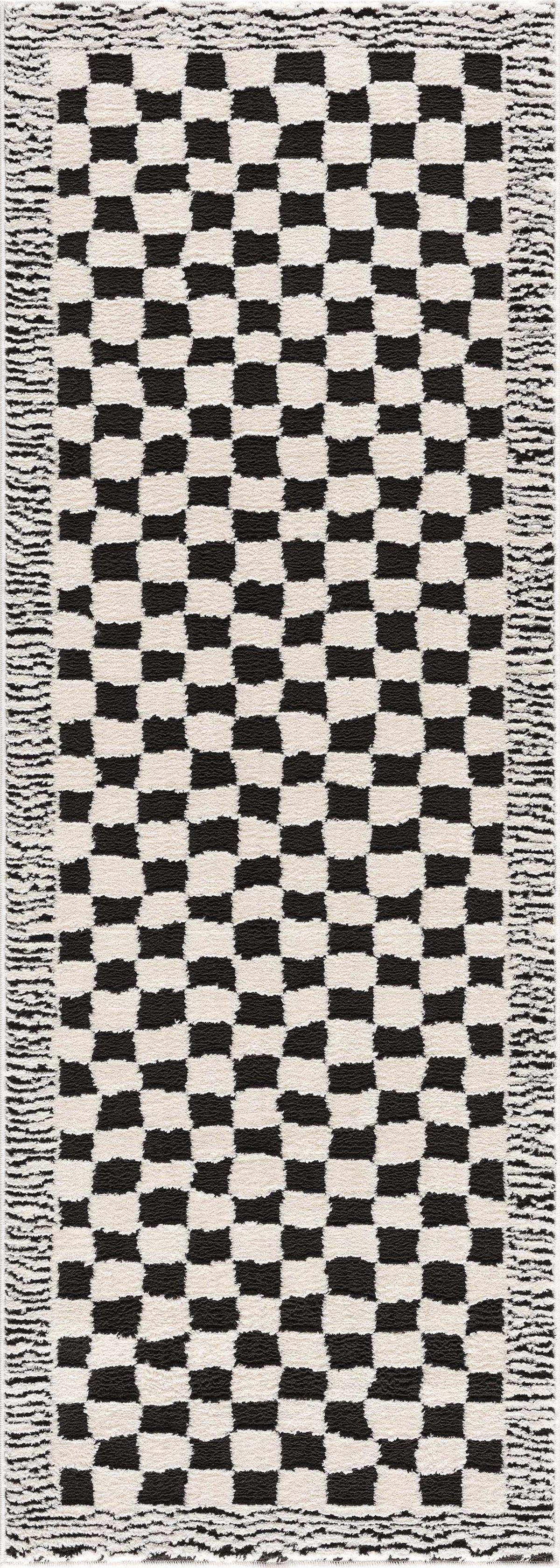 Black and white checkered area rug from Boutique Rugs featuring a bold geometric pattern, ideal for modern home decor.