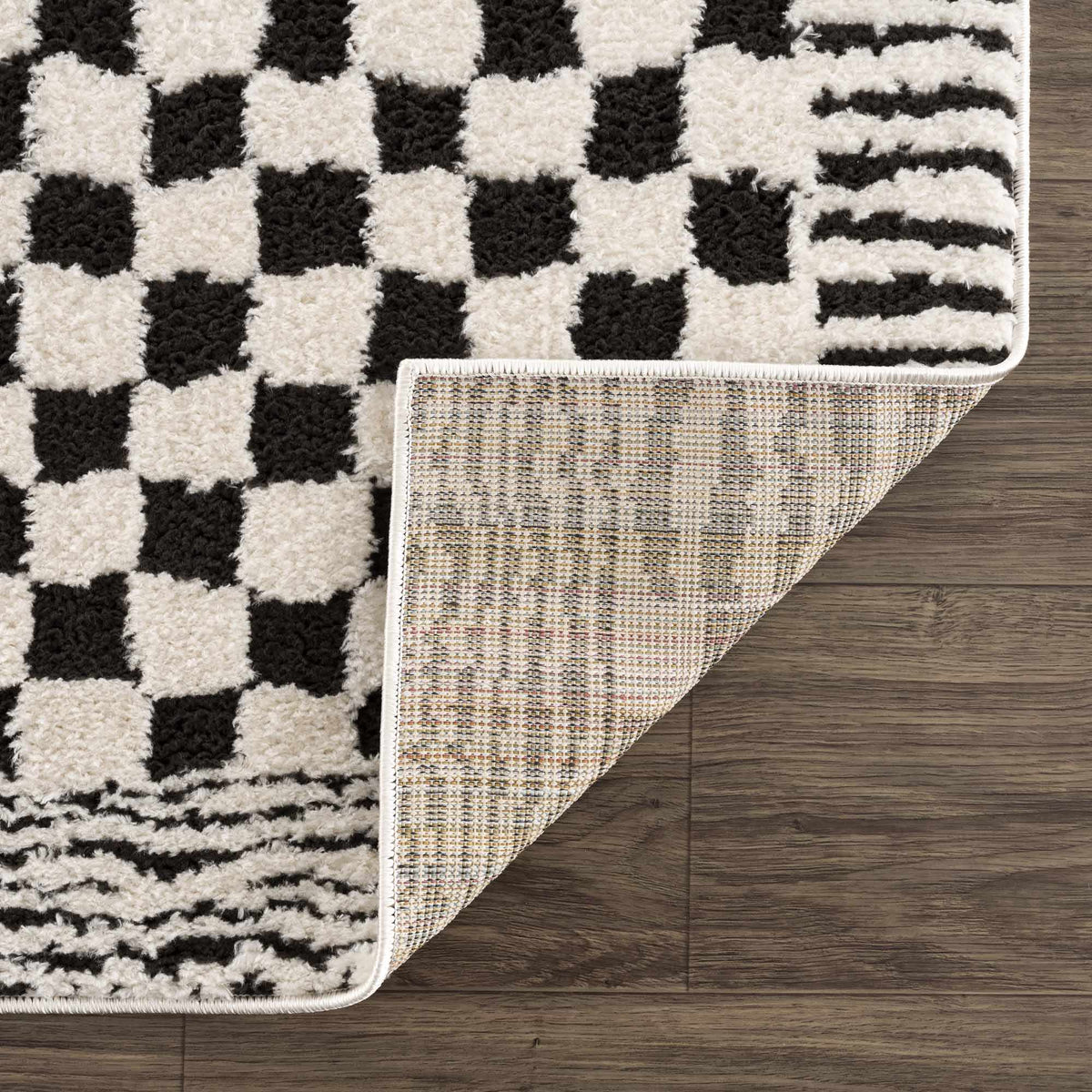 Black and white checkered area rug from Boutique Rugs, featuring a stylish geometric pattern and soft texture.