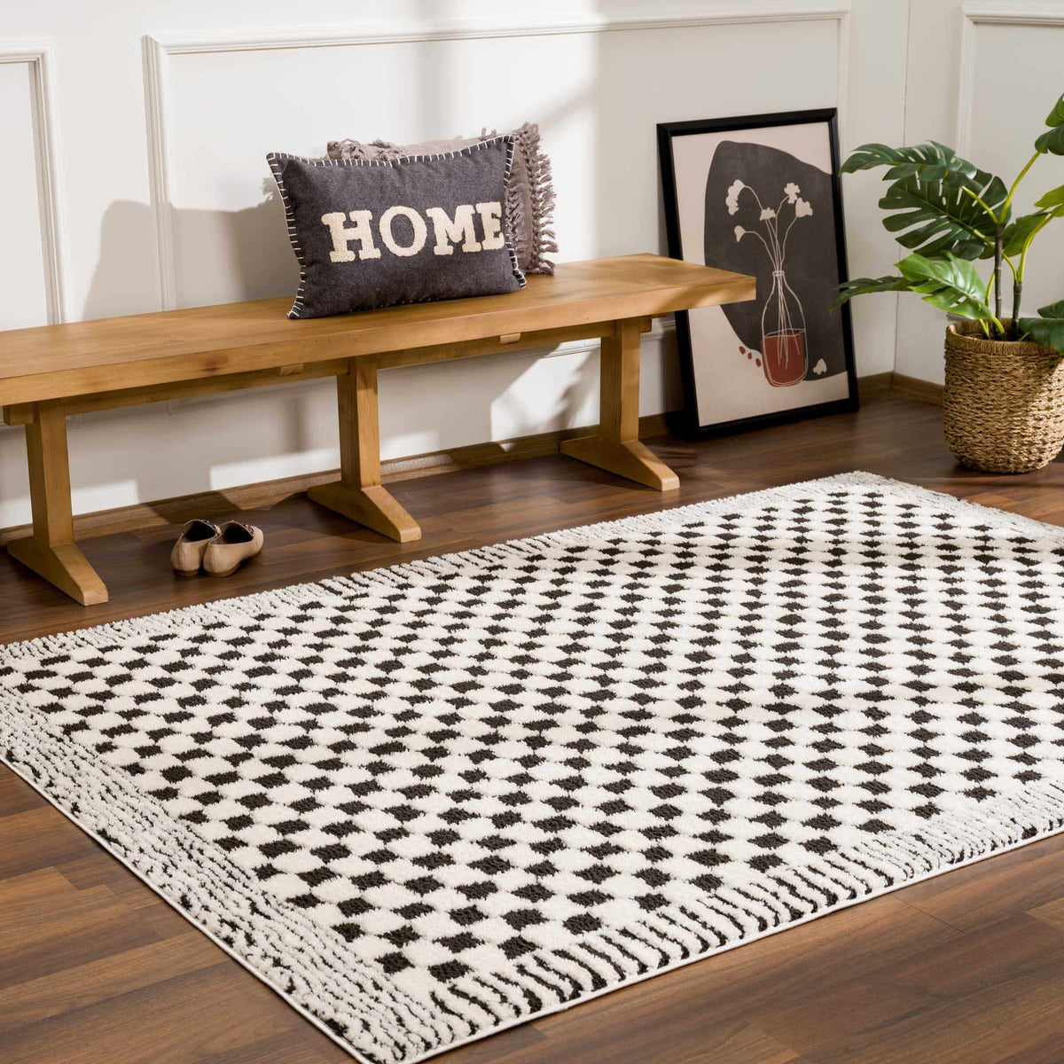 Black and white checkered area rug from Boutique Rugs, shown in a cozy room setting with furniture and decor.