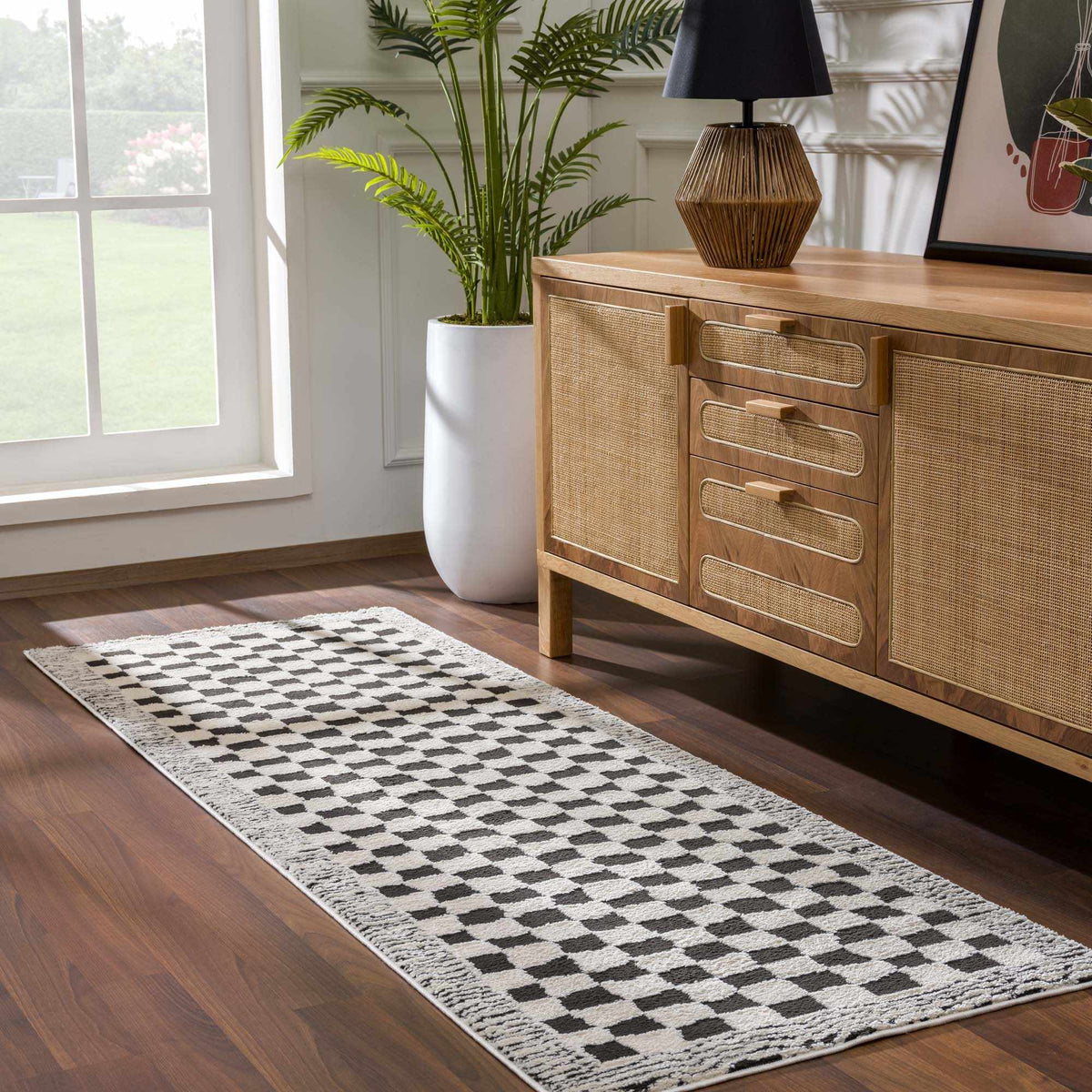 Black and white checkered area rug by Boutique Rugs, shown in a stylish room setting with modern decor.